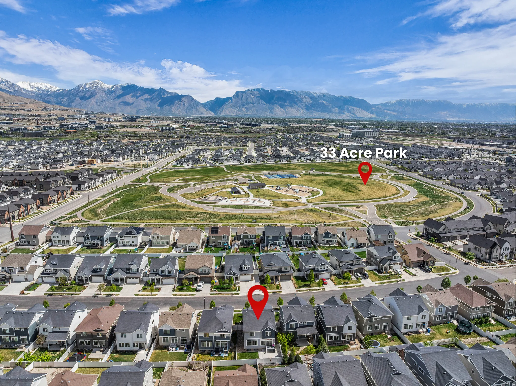 Aerial perspective of suburban area with a mountainous background