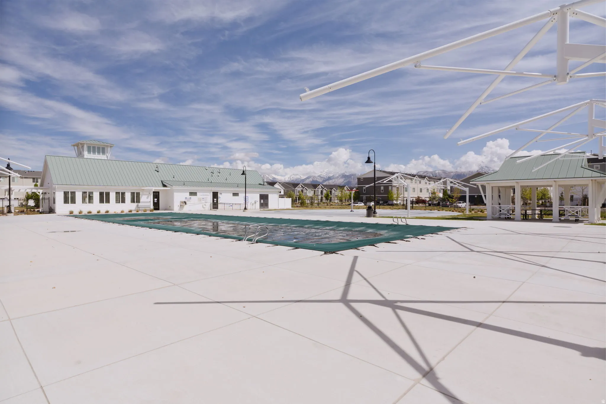 Community pool featuring a patio