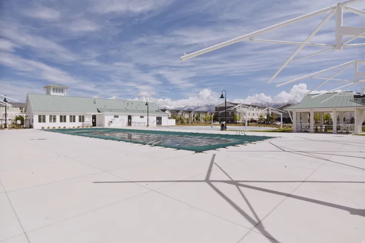 Community pool featuring a patio