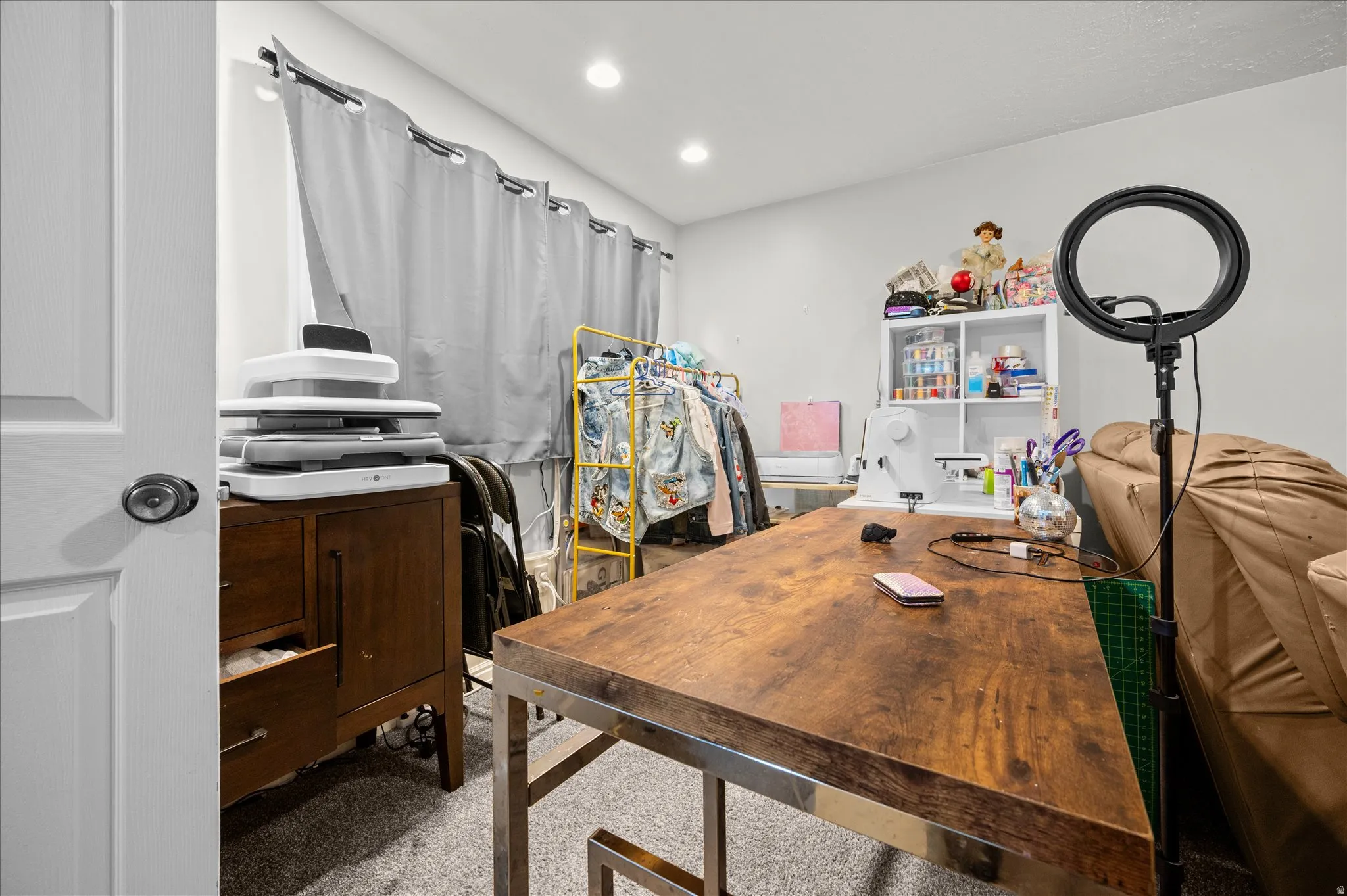 Home office with recessed lighting and light colored carpet