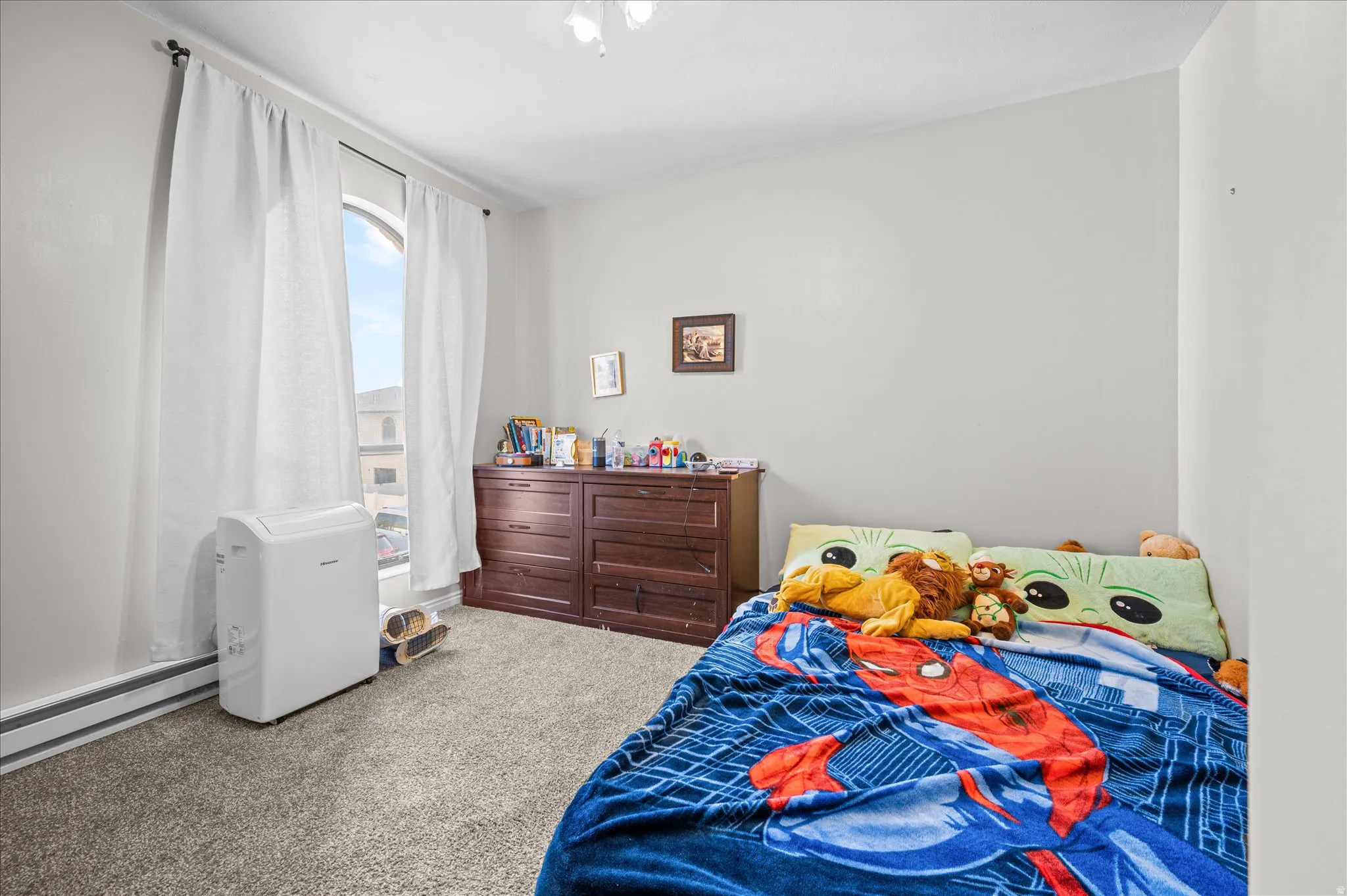 Bedroom with light colored carpet
