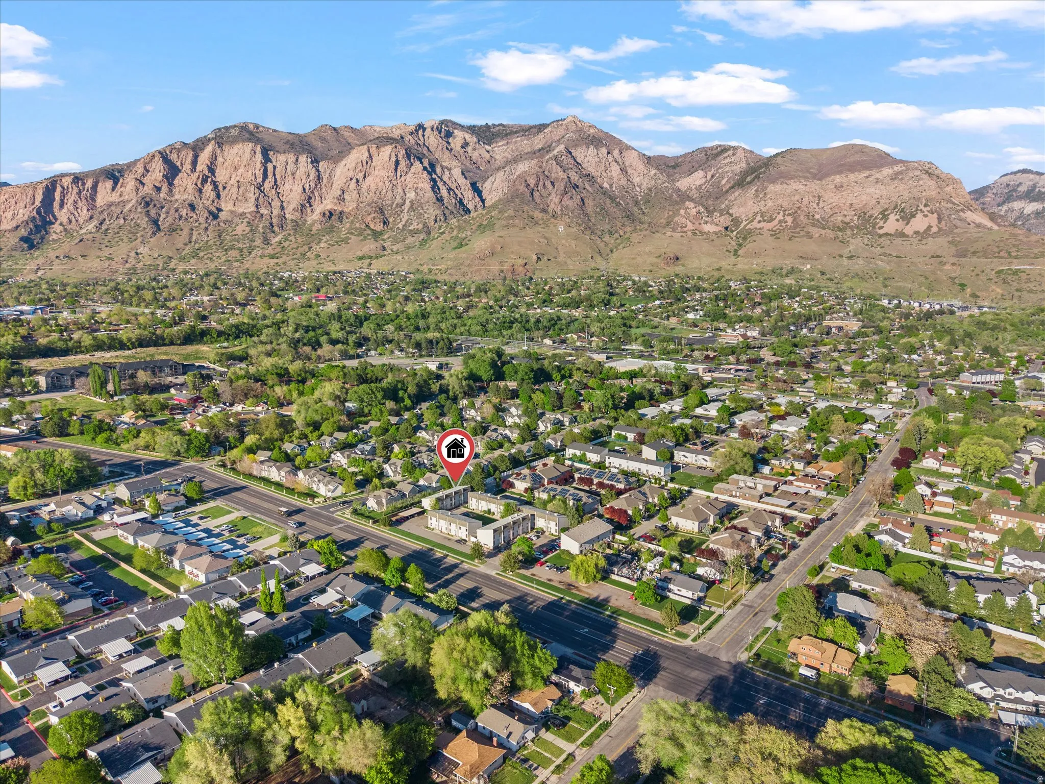 Aerial view of residential area with a mountainous background
