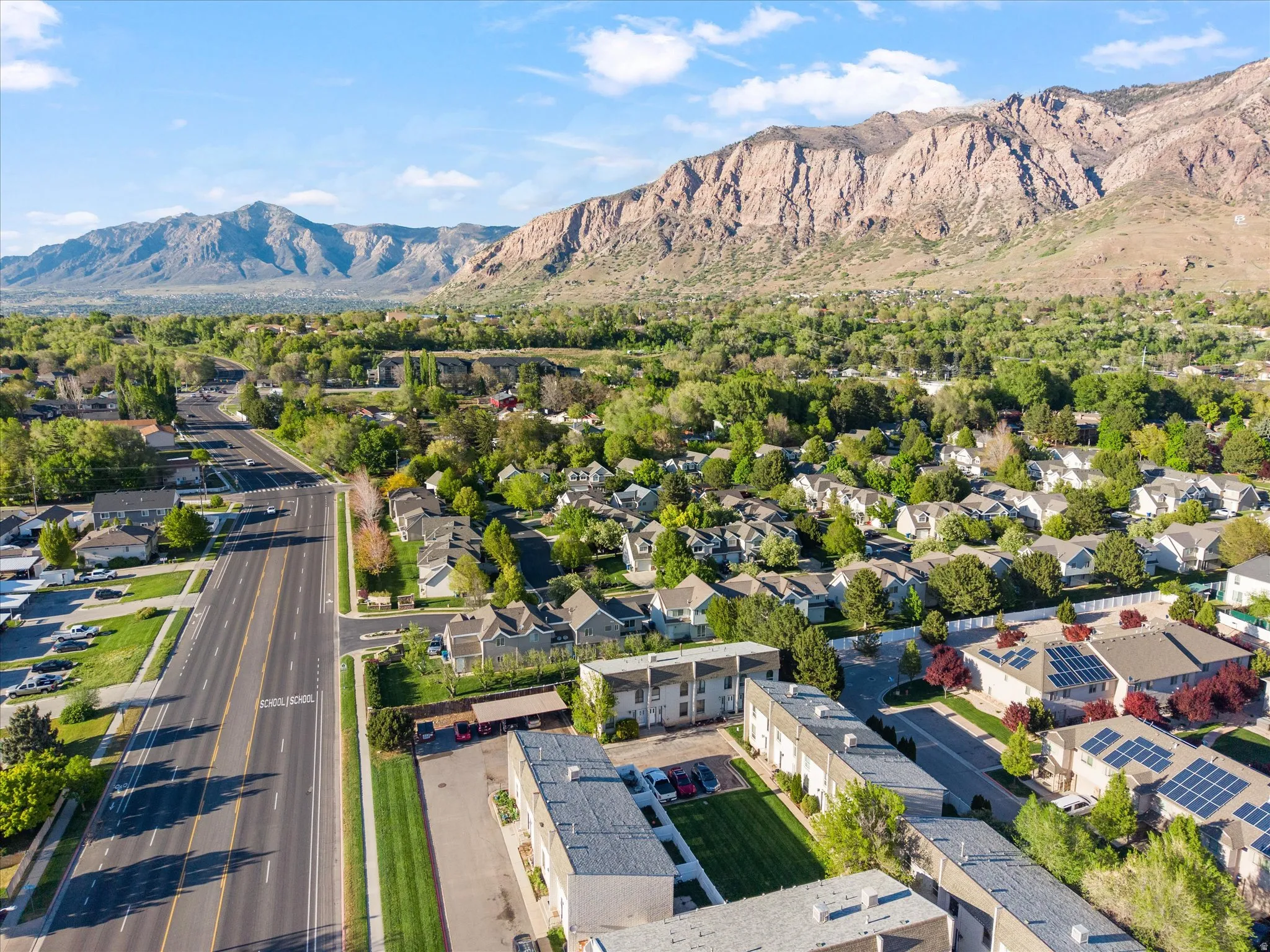 Aerial view of residential area with a mountain backdrop