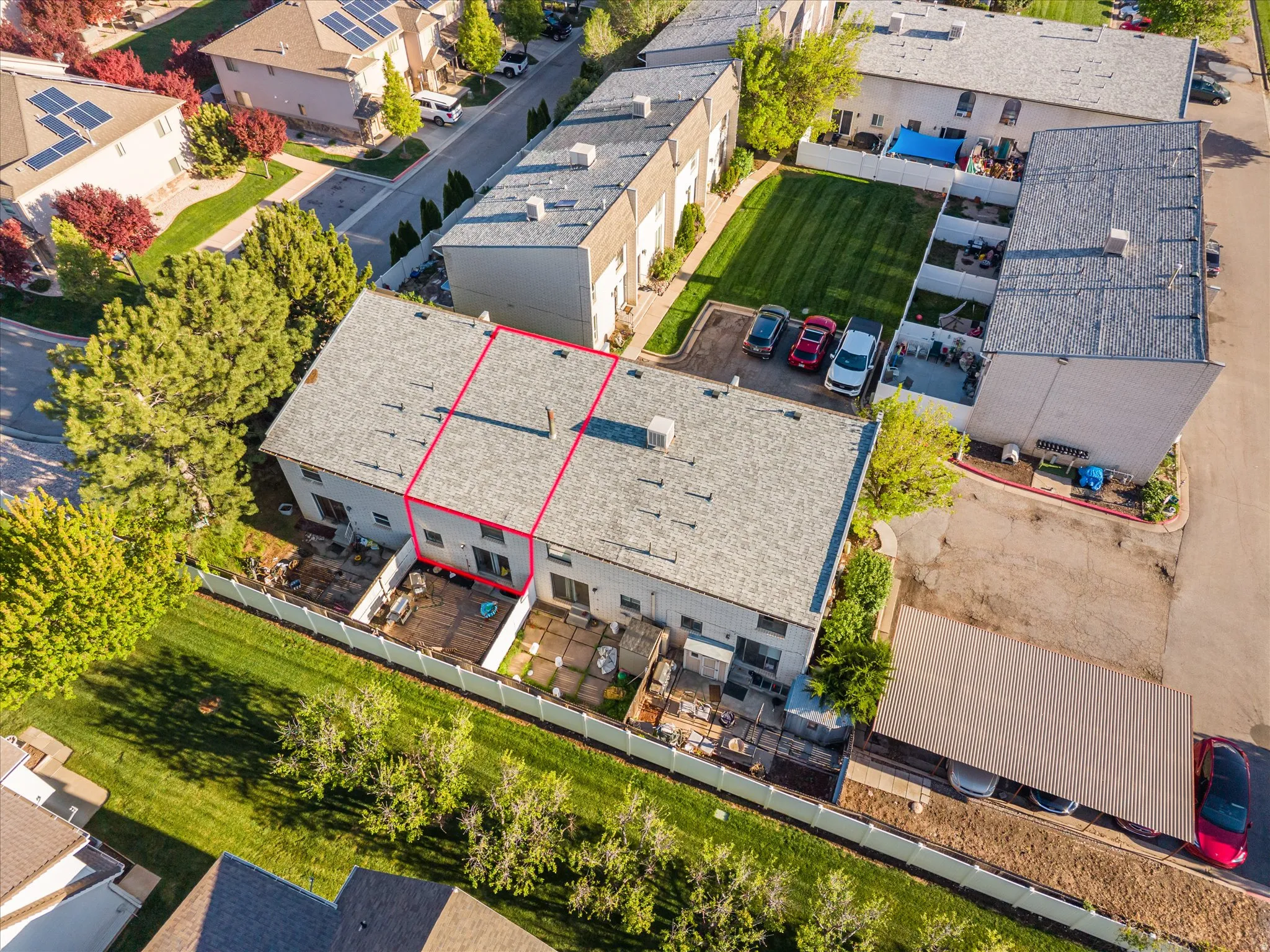 Aerial view of residential area with property boundaries highlighted