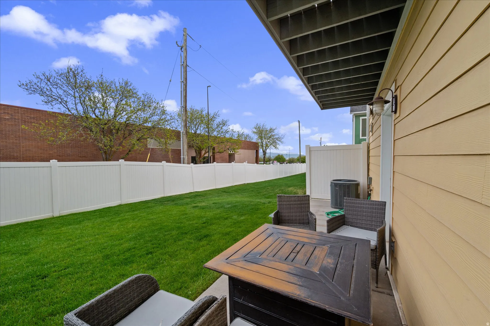 Fenced yard with a patio area