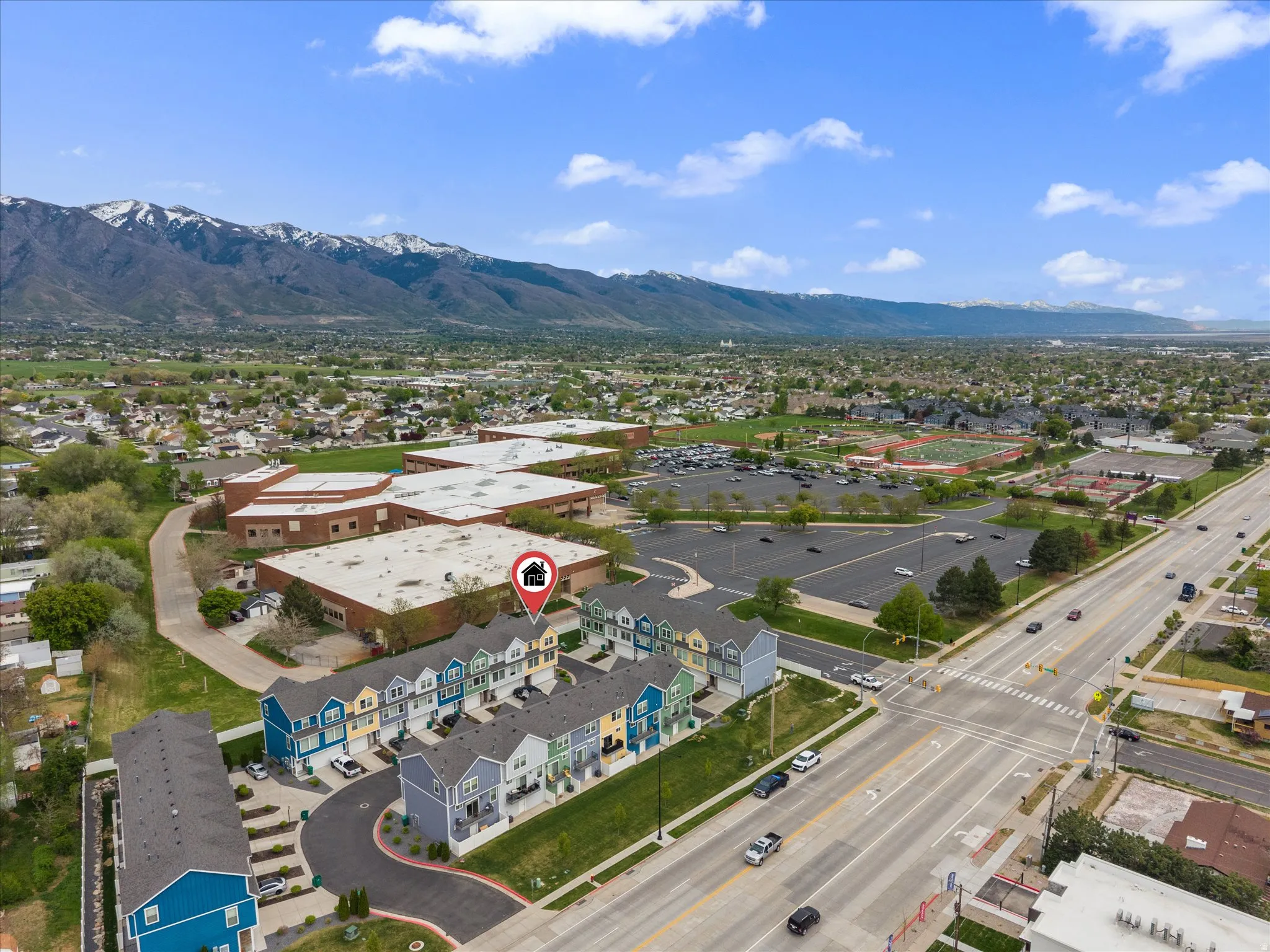 Aerial view of residential area featuring mountains