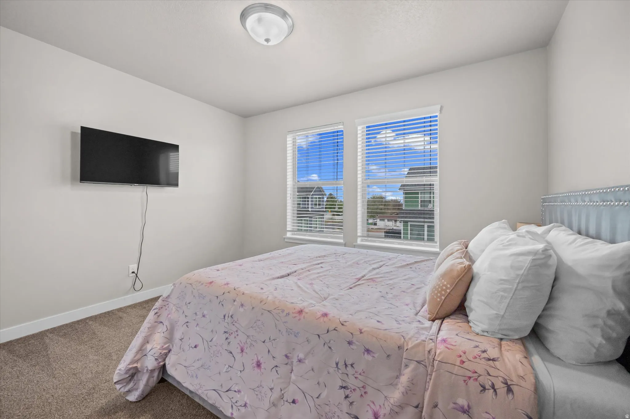 Carpeted bedroom with baseboards
