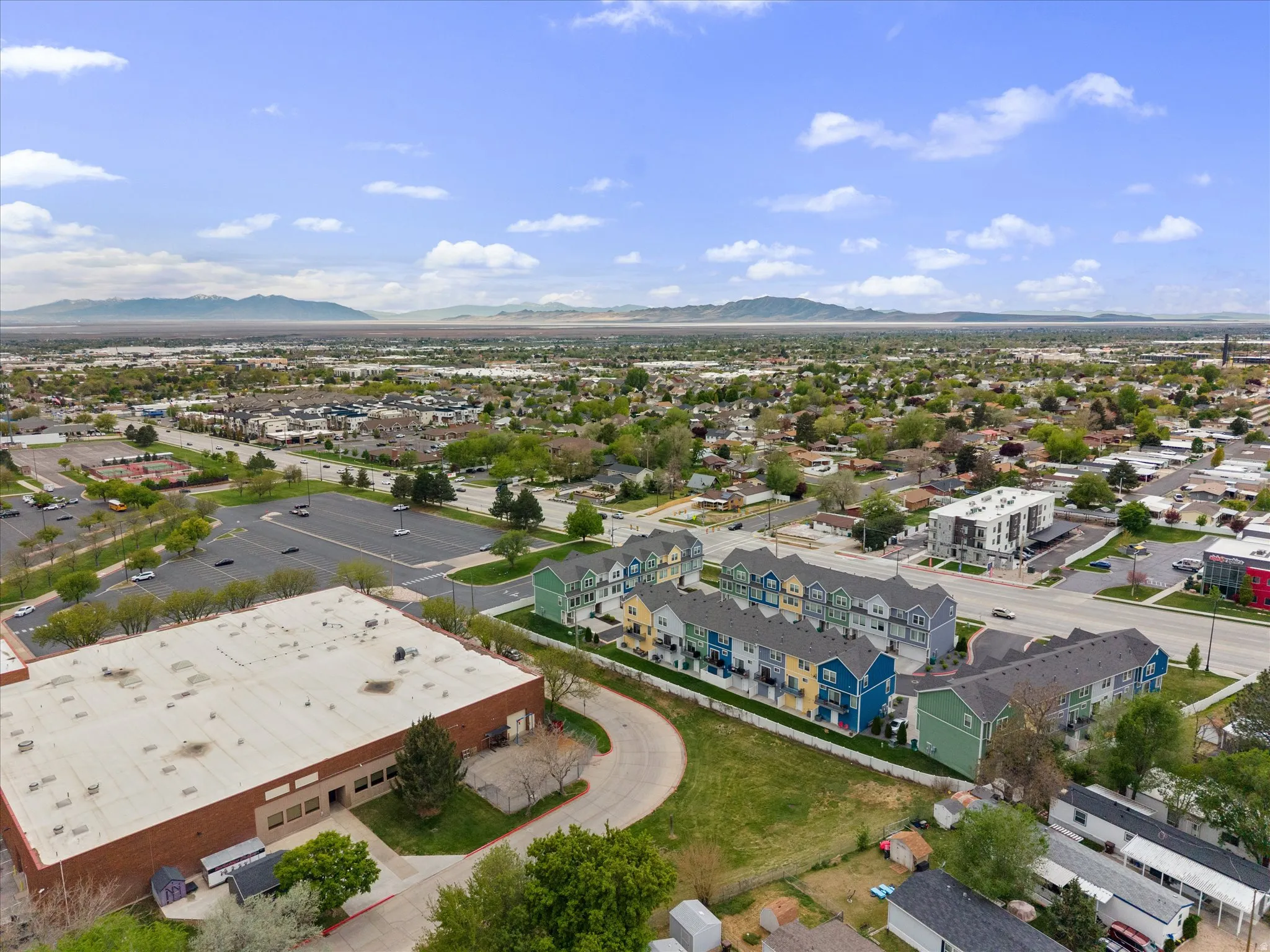 Aerial perspective of suburban area featuring a mountain backdrop