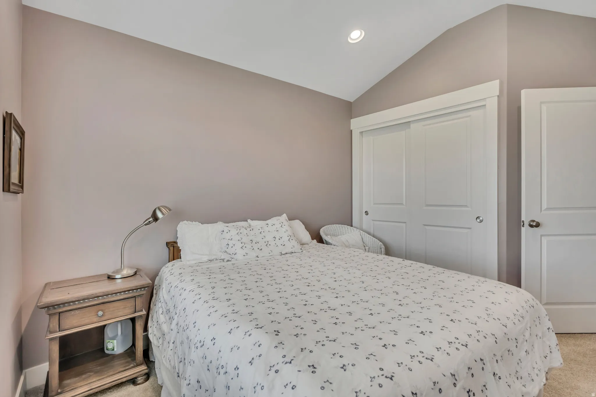 Bedroom with carpet, recessed lighting, a closet, and lofted ceiling