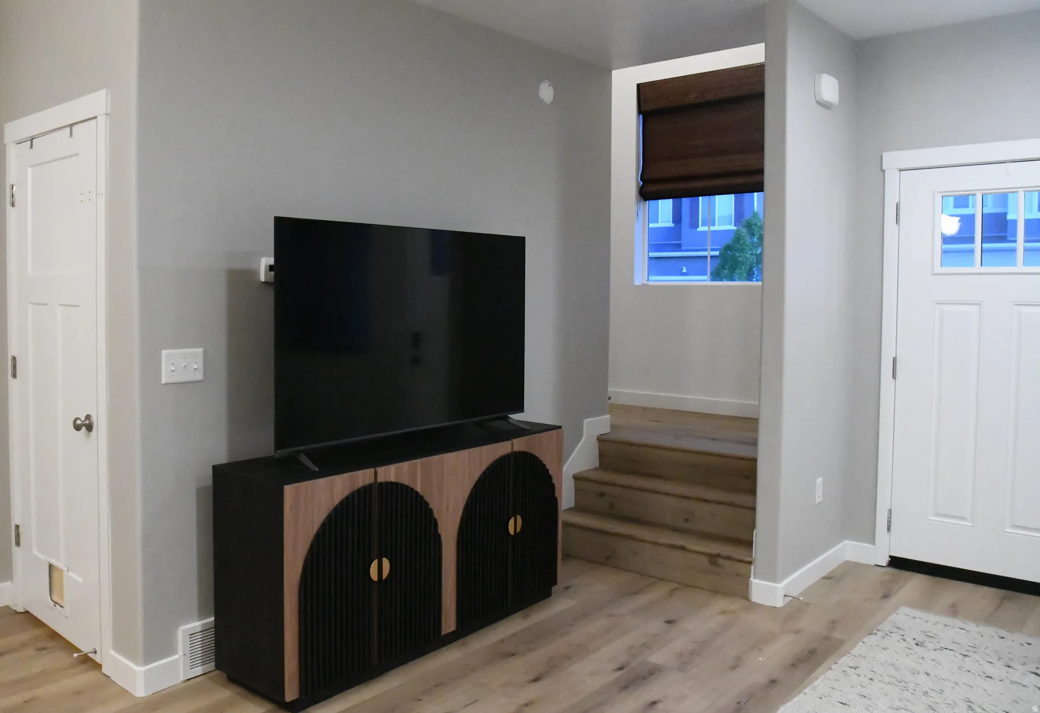Foyer entrance featuring light wood finished floors