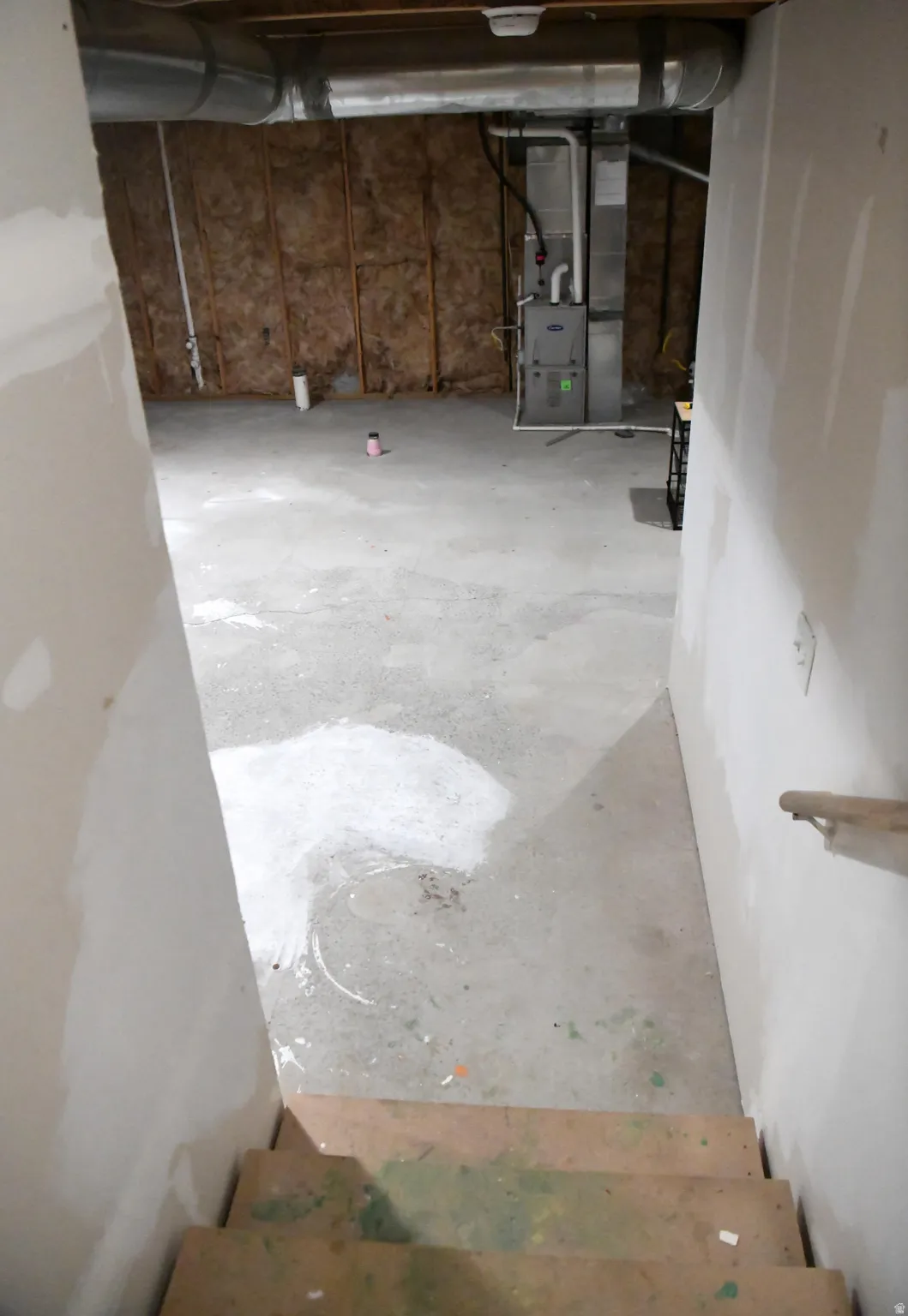 Unfinished basement featuring heating unit