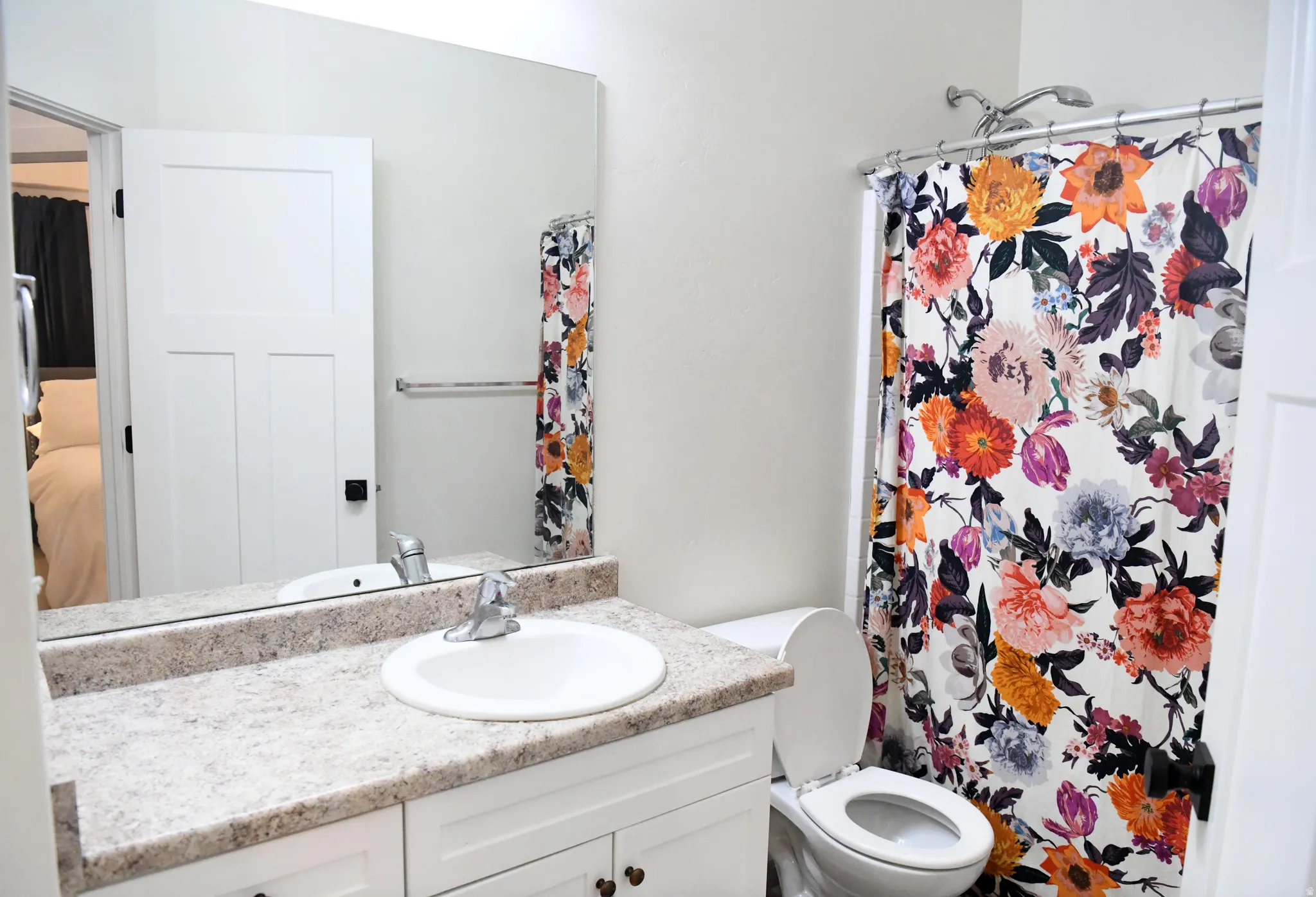 2nd Bathroom with vanity, curtained shower, and connected bathroom