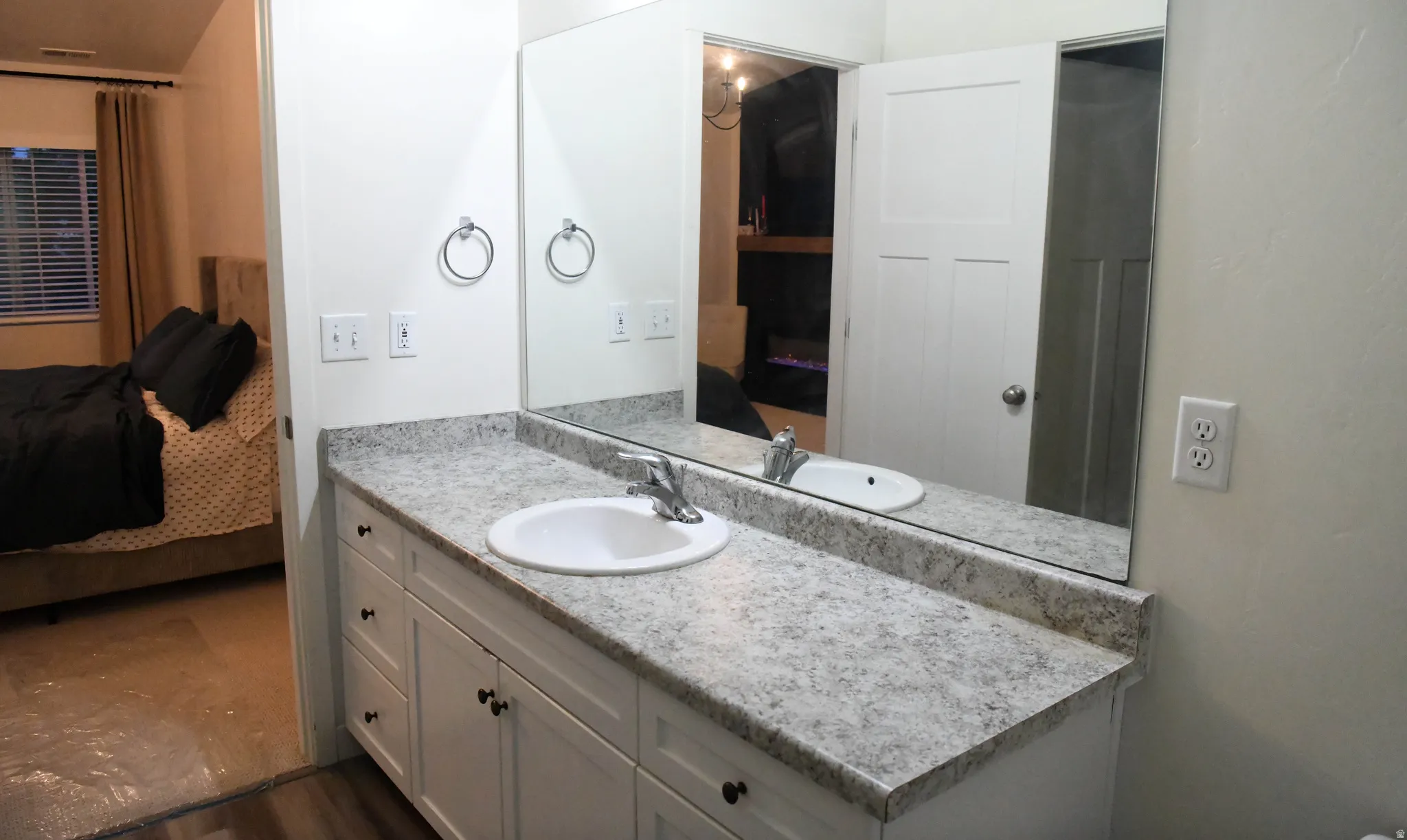 Primary bathroom featuring connected bathroom and vanity