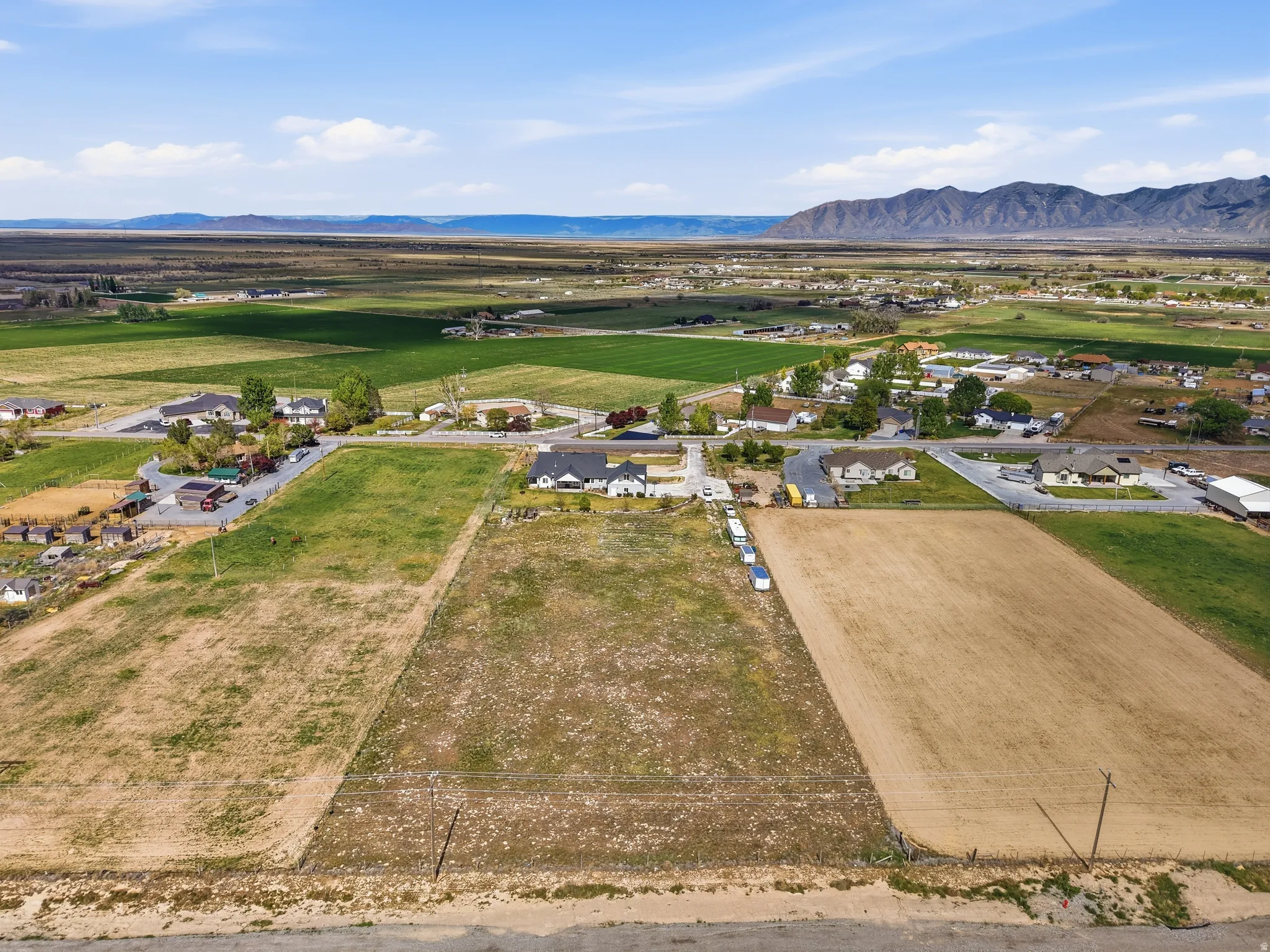 Overview of rural landscape featuring a mountain backdrop