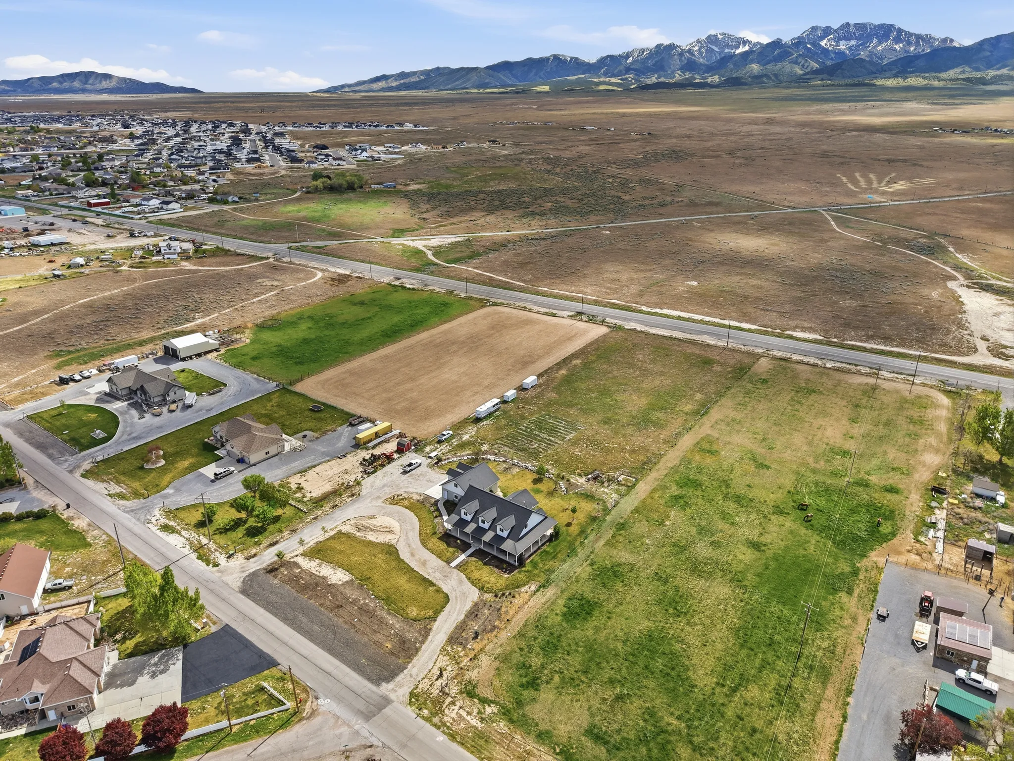 Aerial overview of property's location featuring rural landscape and nearby suburban area