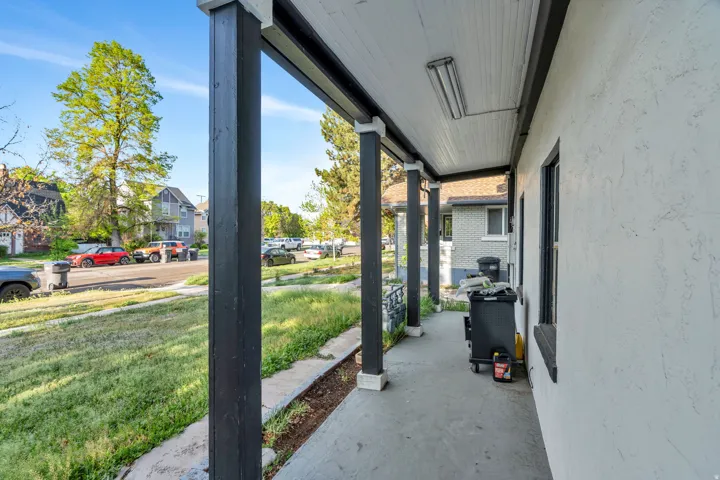 Porch with a yard and a residential view.