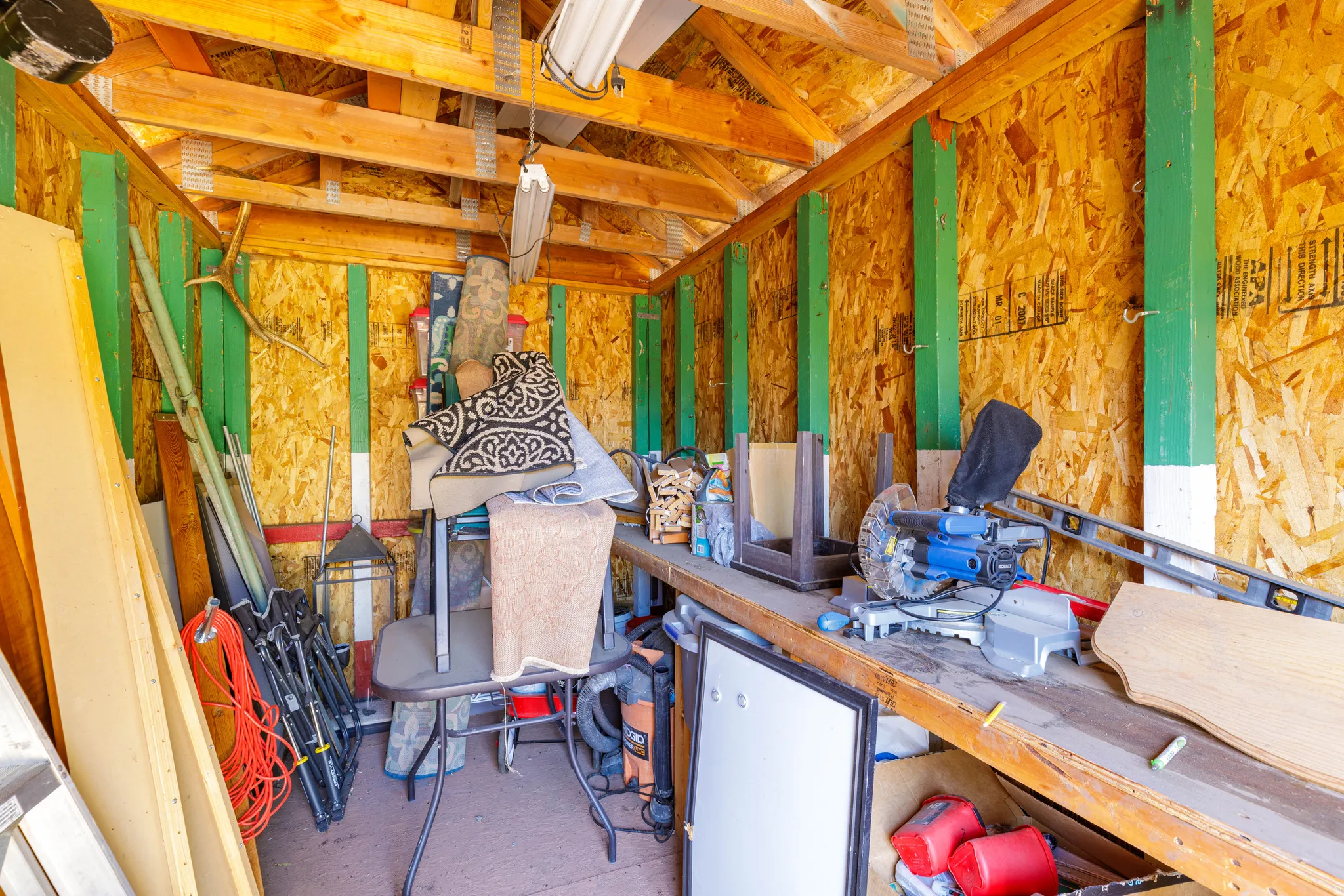 Workshop Interior: Fully functional workshop or storage space within the second outbuilding.