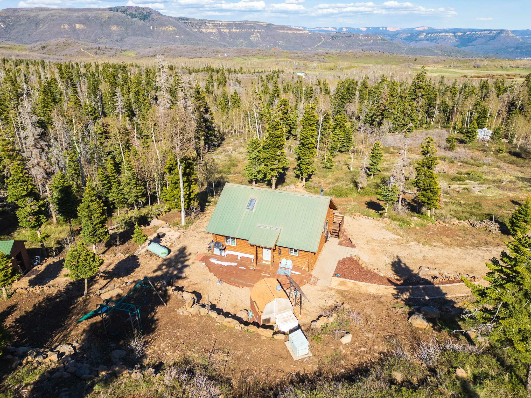 Secluded Log Living: A final beauty shot highlighting the privacy of the cabin site.