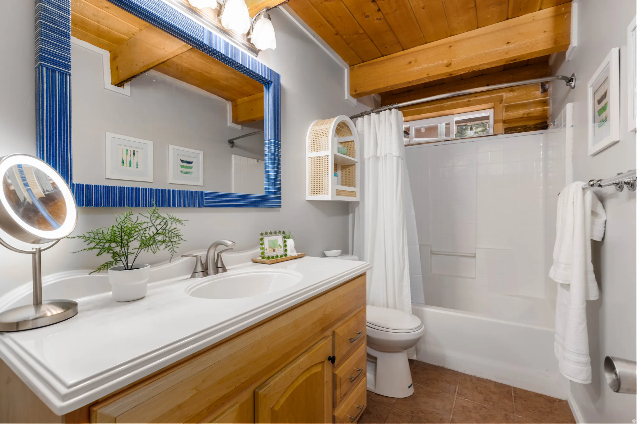 Full Bathroom: Clean, functional full bath with large vanity and tub/shower combo.