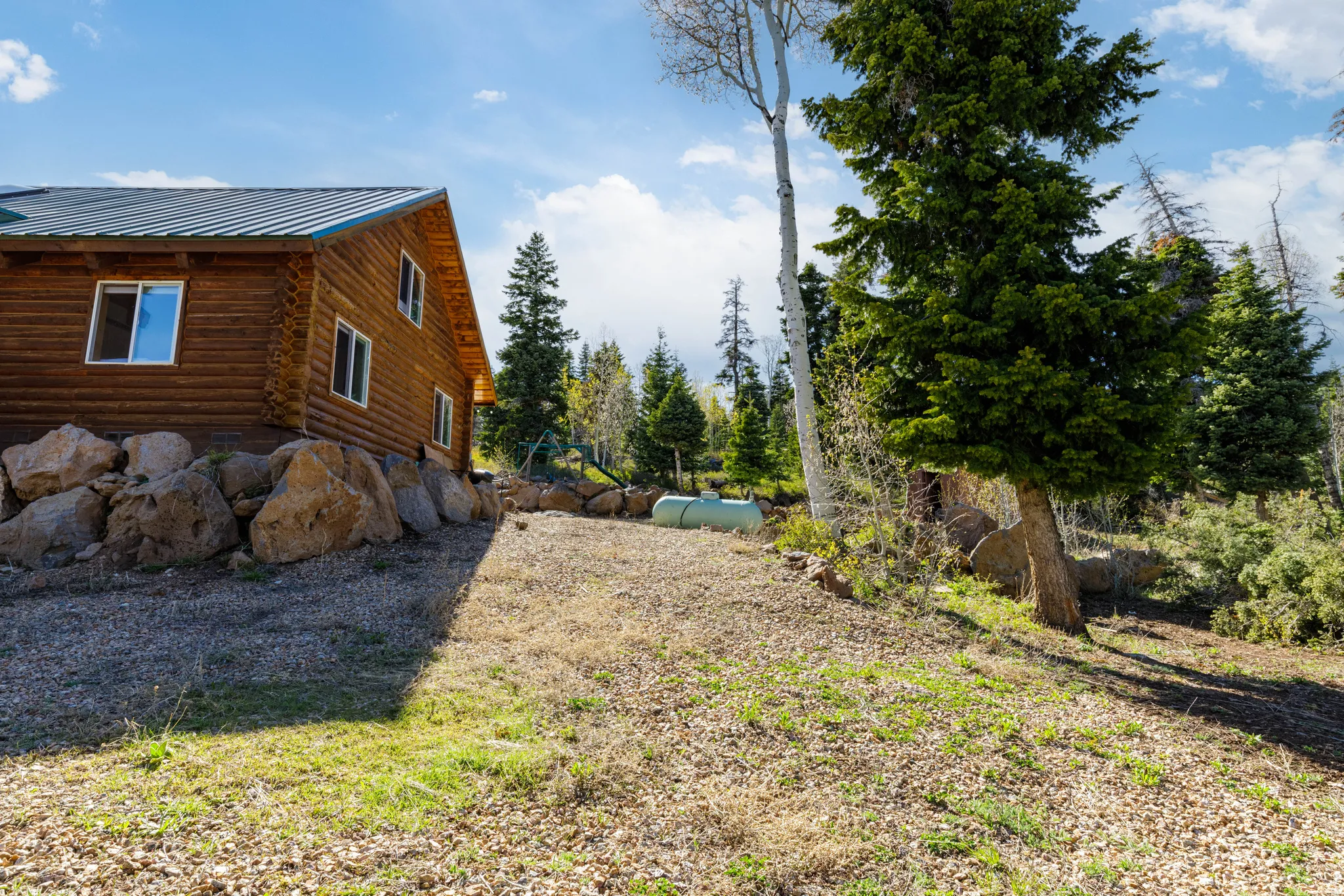 North Elevation: Side view of the cabin highlighting the well-maintained exterior.
