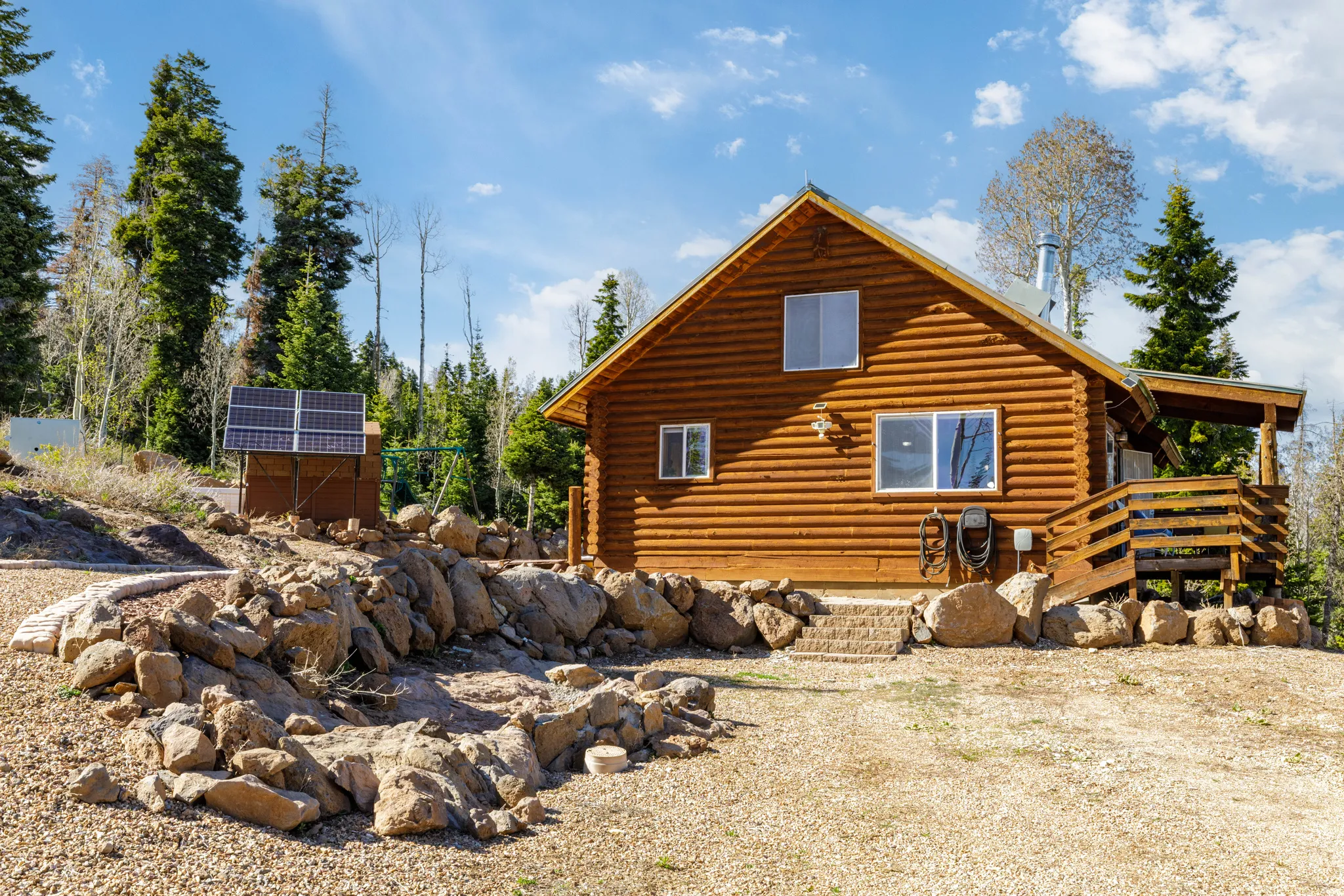 Solar Array & Cabin: Highlights the off-grid capability and close proximity of the power shed.