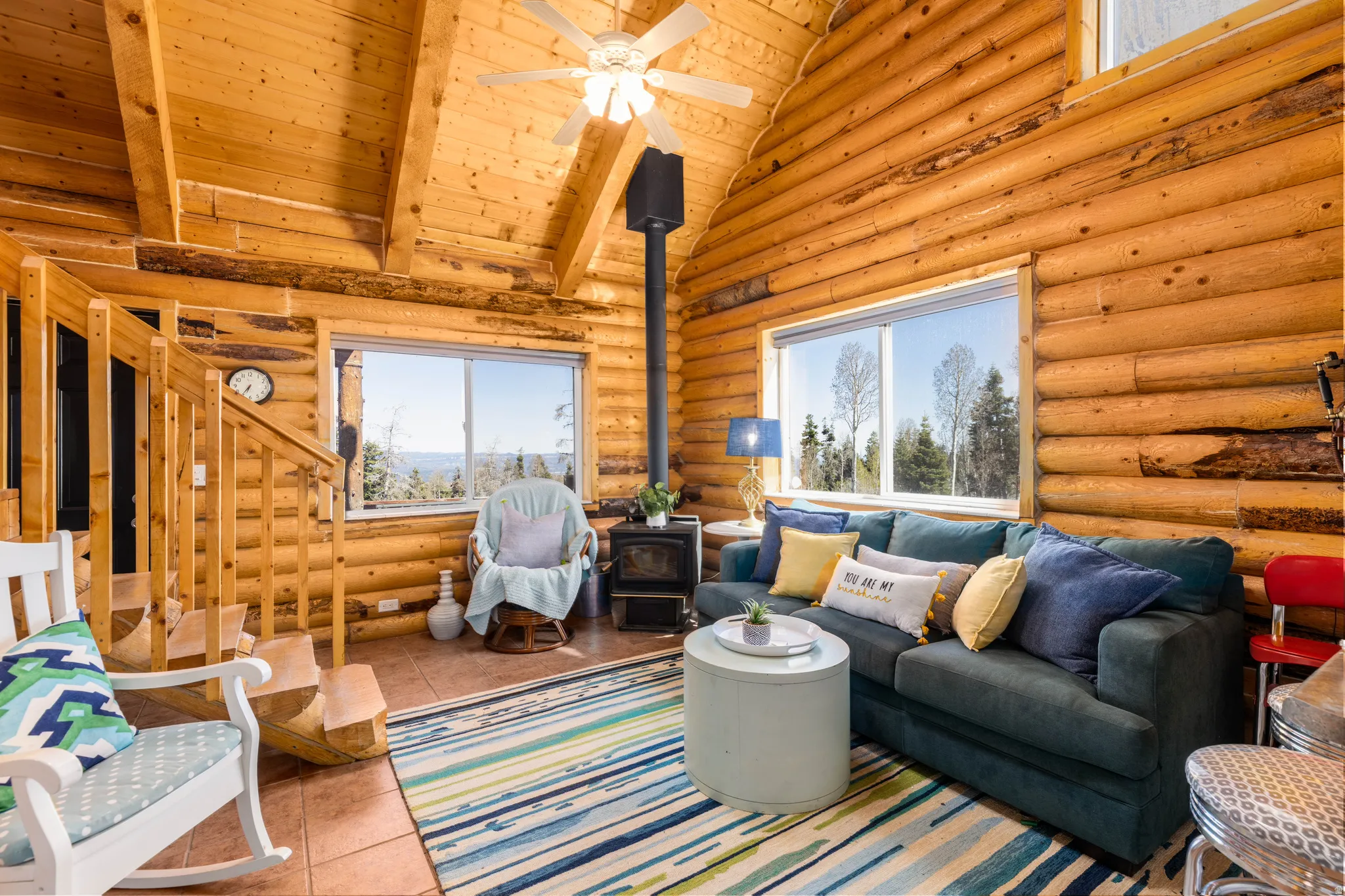 Grand Great Room: Vaulted ceilings and large windows flood the main living area with natural light.