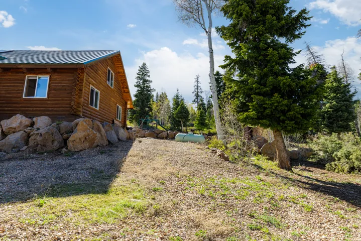 North Elevation: Side view of the cabin highlighting the well-maintained exterior.