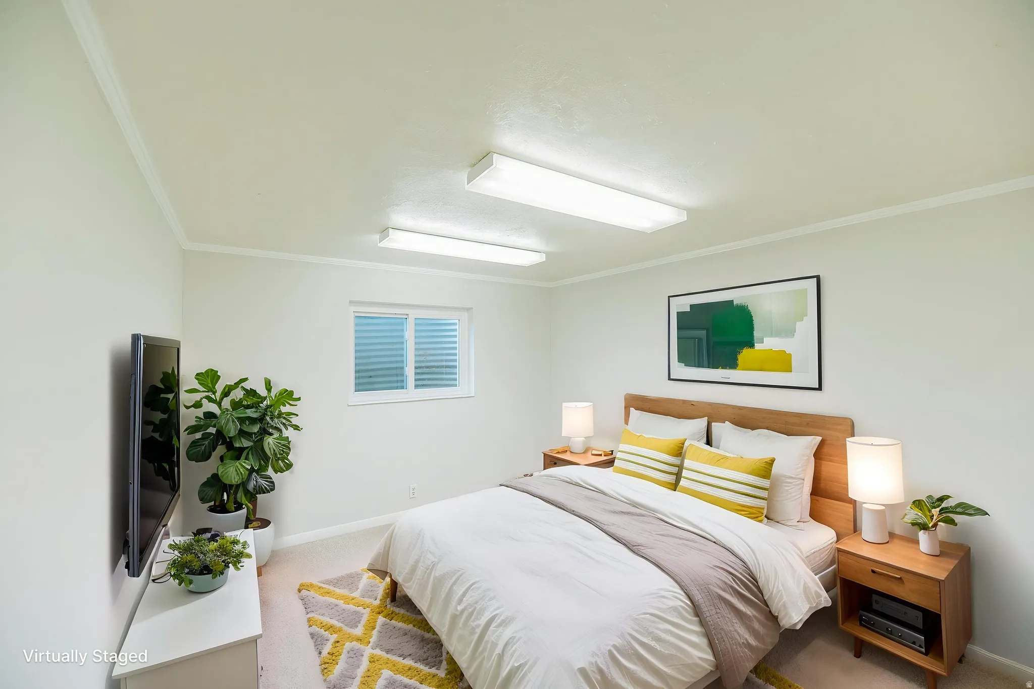 Carpeted bedroom with ornamental molding