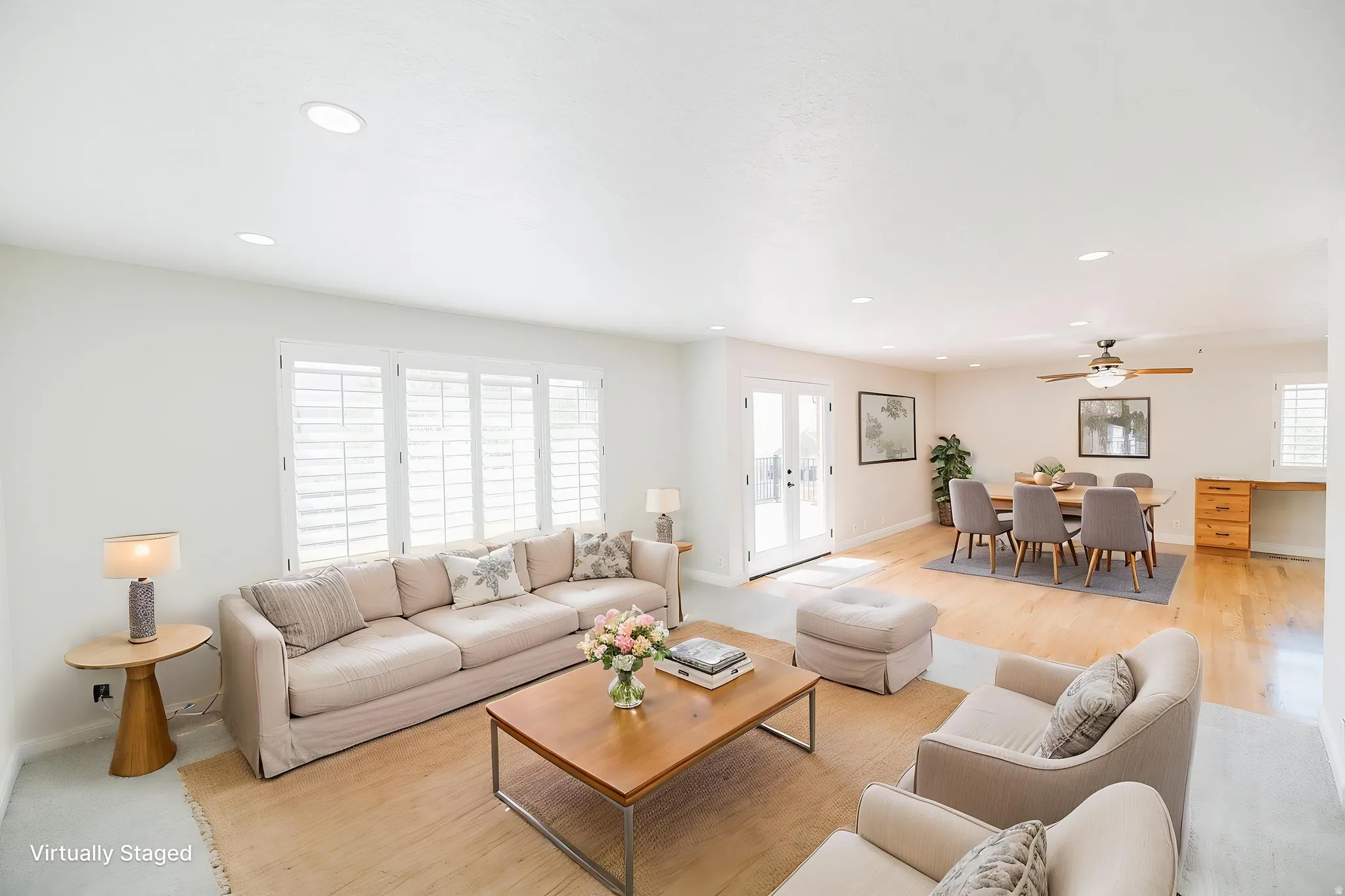 Living area featuring recessed lighting, plenty of natural light, ceiling fan, and french doors