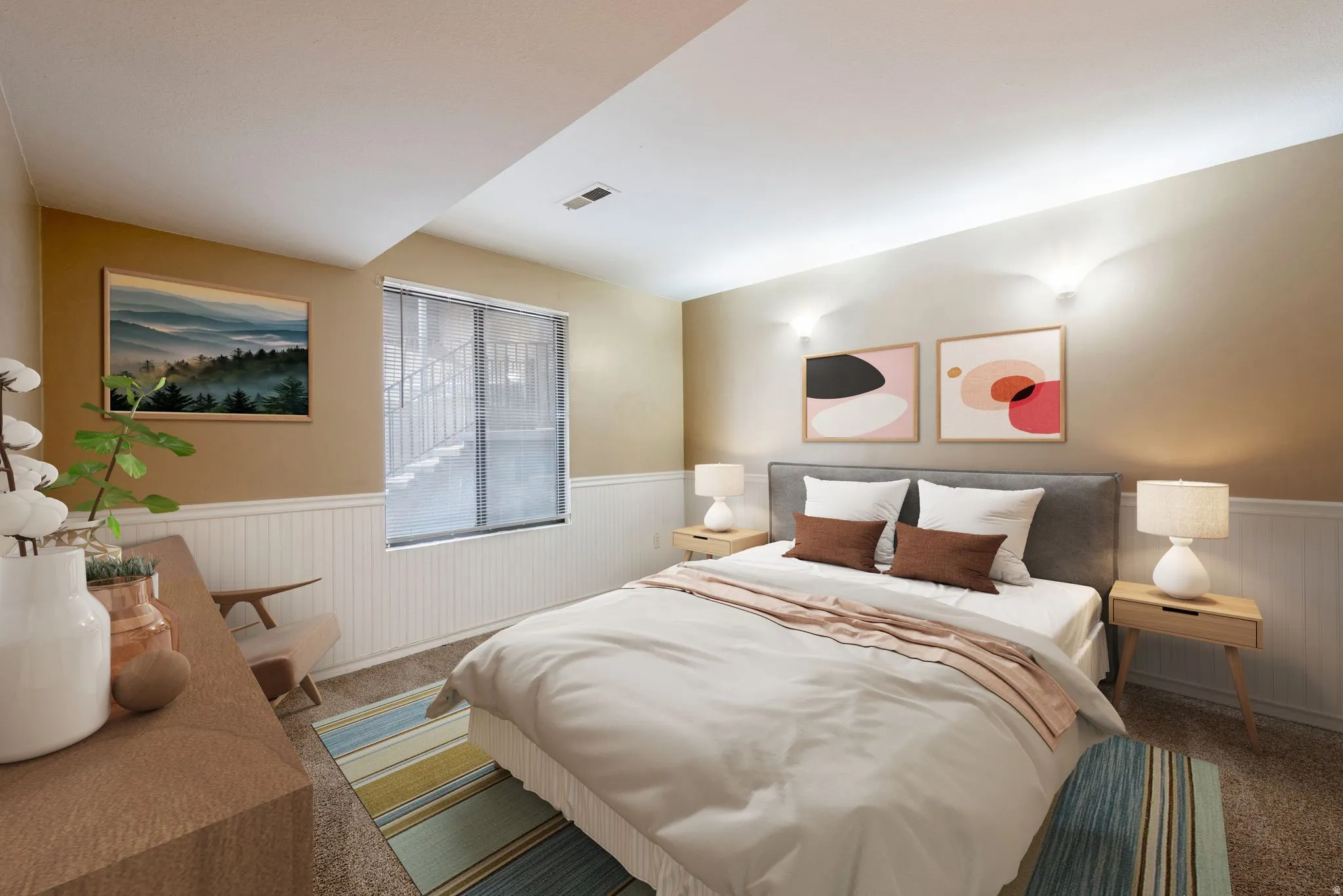 Bedroom with wainscoting and carpet