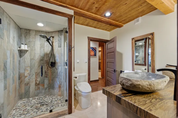 Bathroom with a stall shower, recessed lighting, vanity, light tile patterned floors, and wooden ceiling