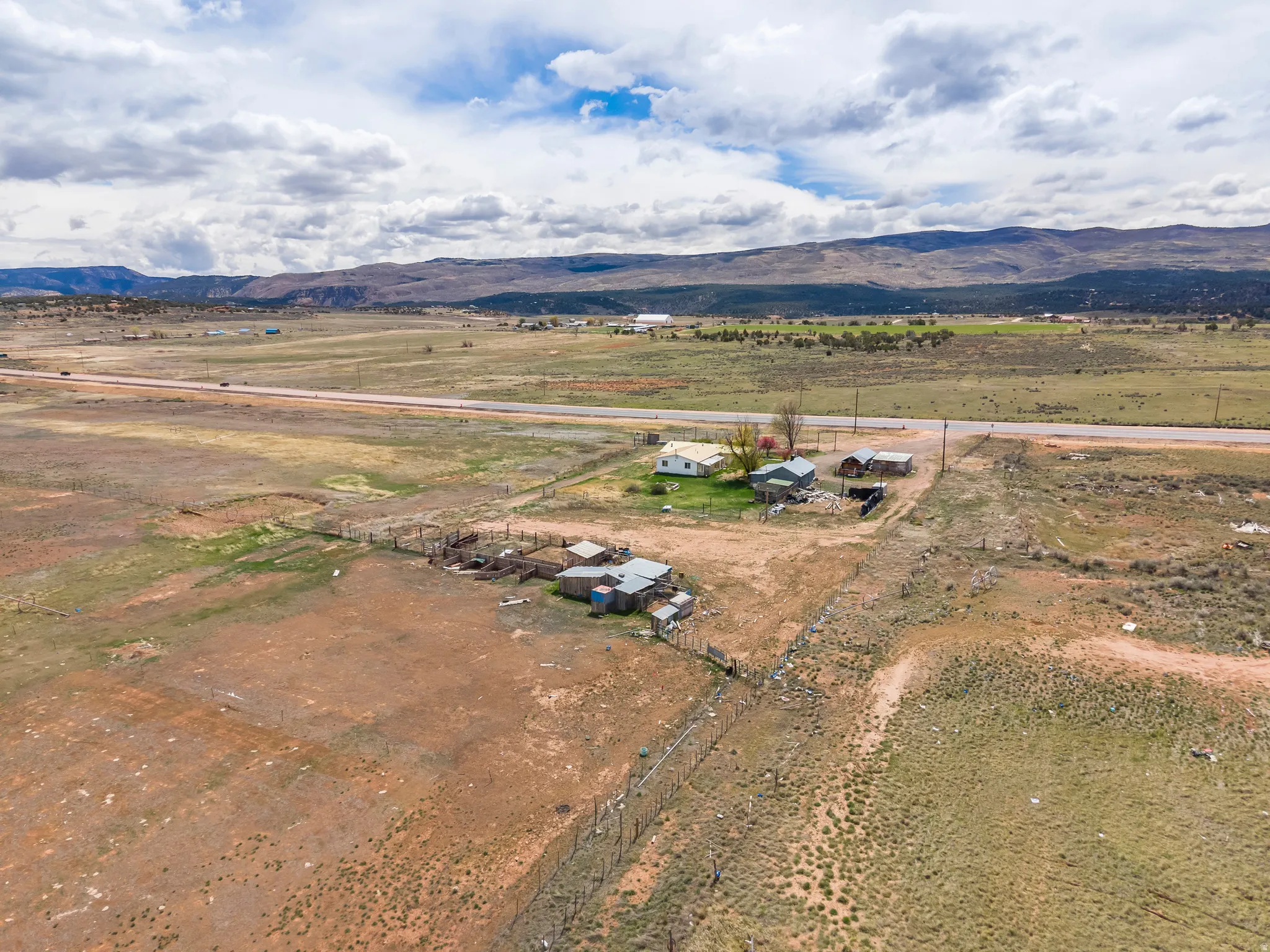 Aerial view of sparsely populated area featuring a mountainous background