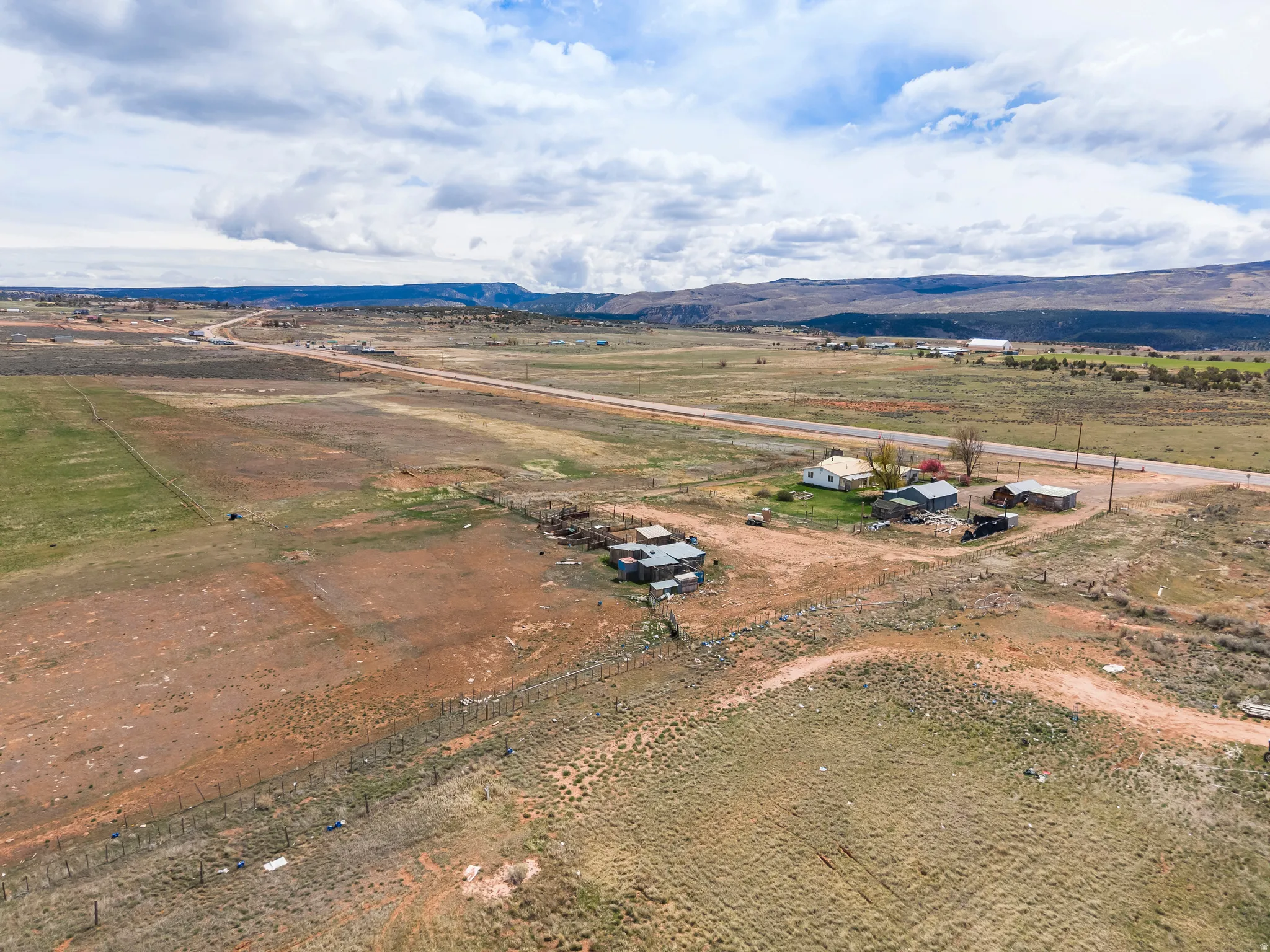 Aerial view of sparsely populated area with a mountain backdrop