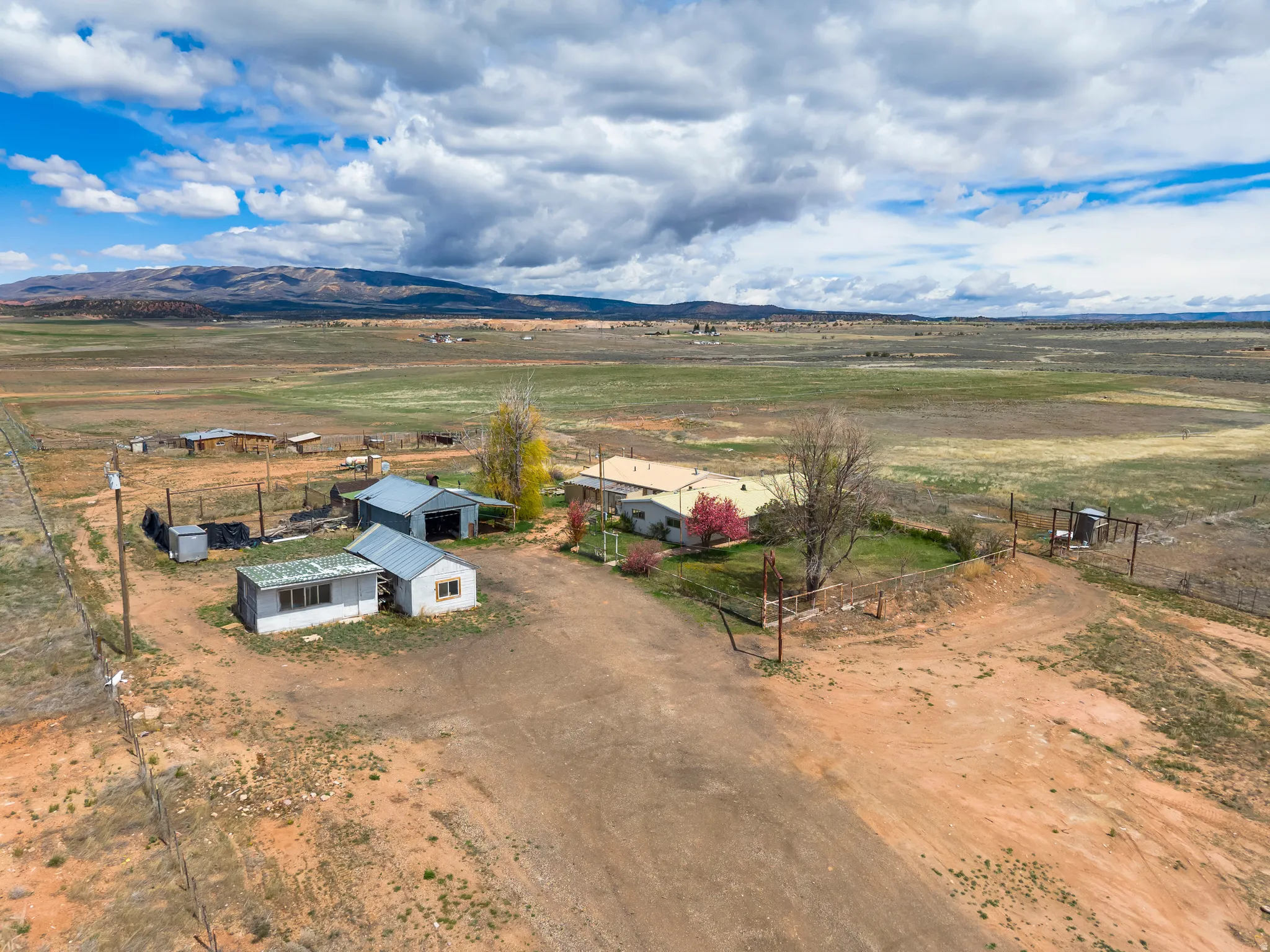 Aerial view of sparsely populated area with a mountainous background