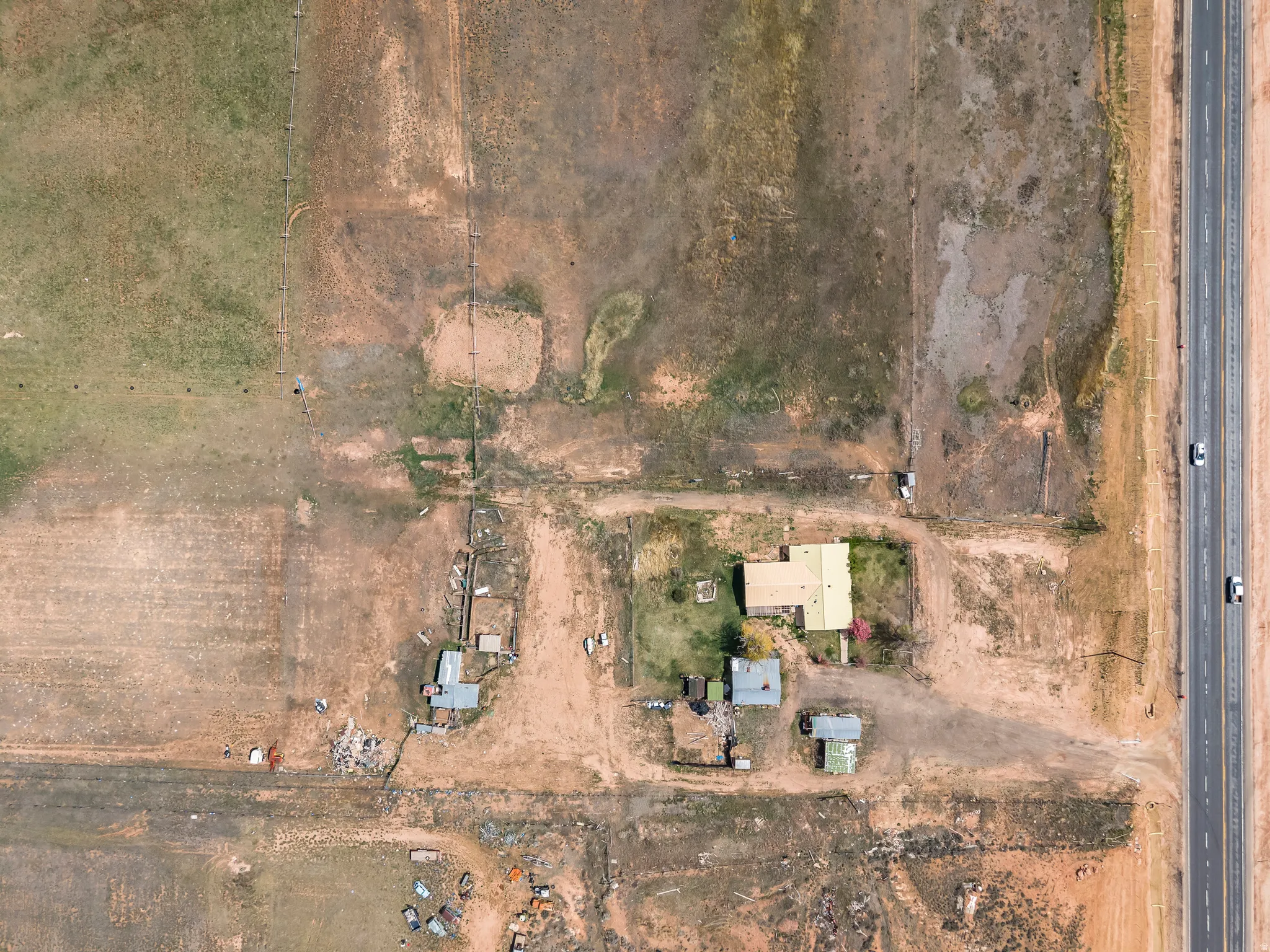 Aerial view of property and surrounding area featuring rural landscape