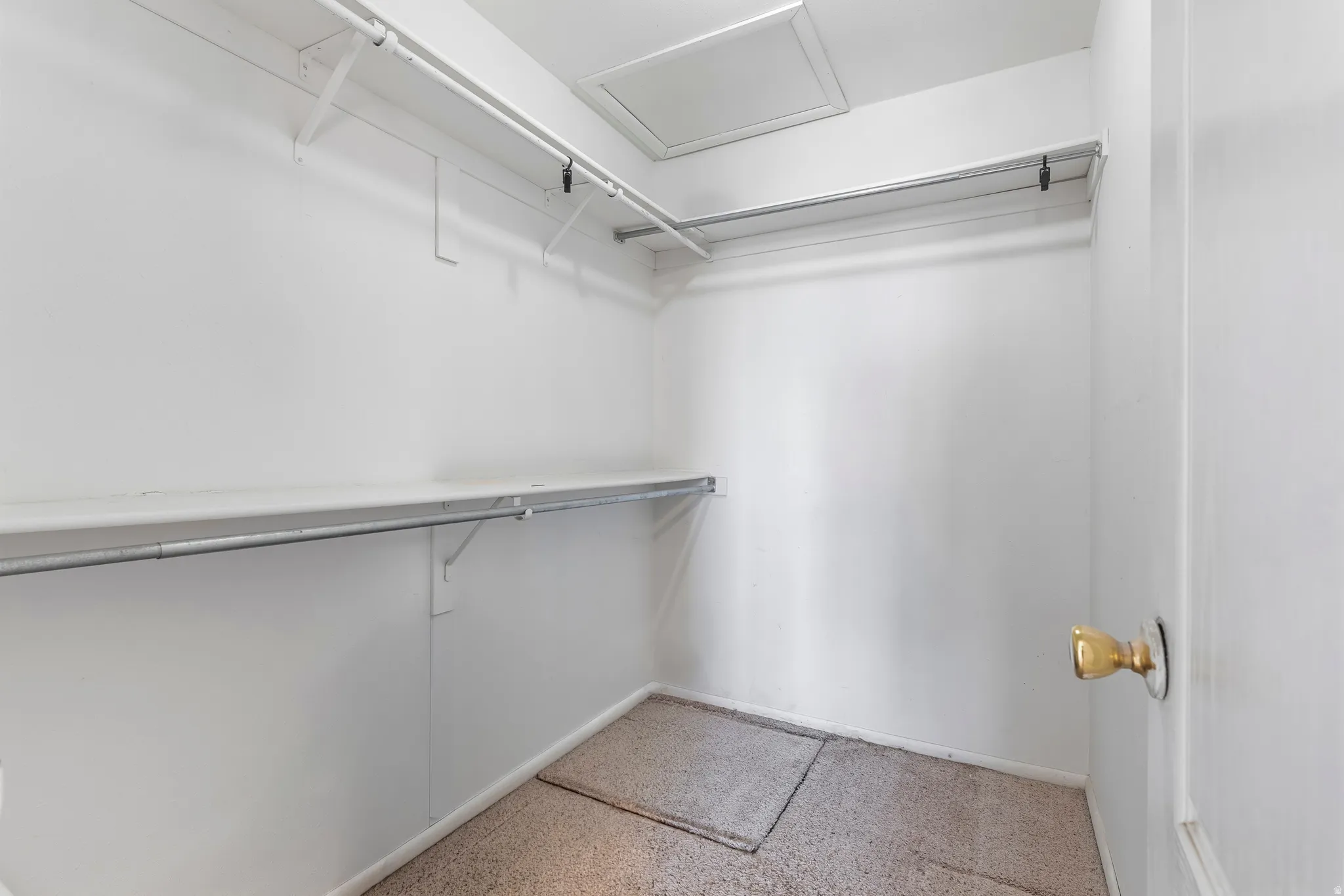 Walk in closet with attic access