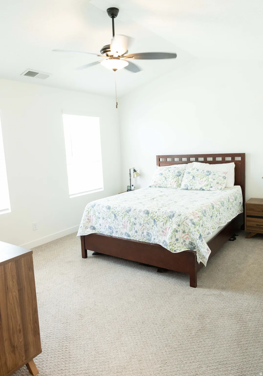 Bedroom featuring ceiling fan and light colored carpet