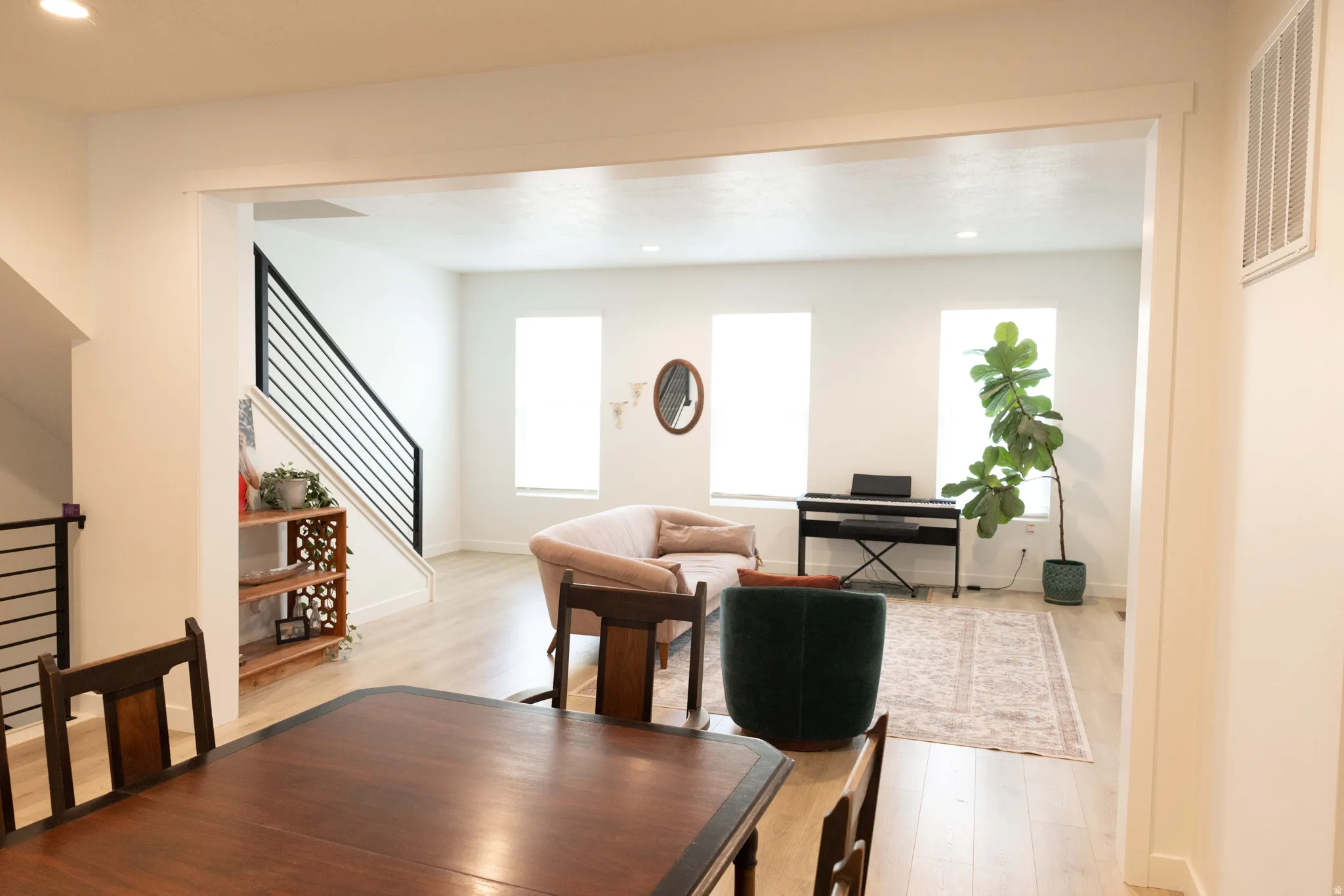 Dining room with recessed lighting and light wood-style floors