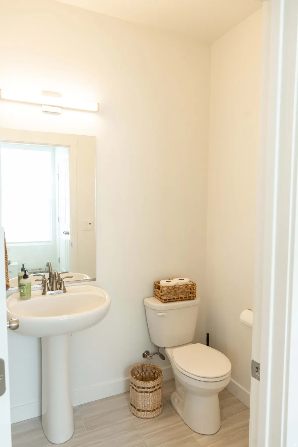 Bathroom with toilet and baseboards