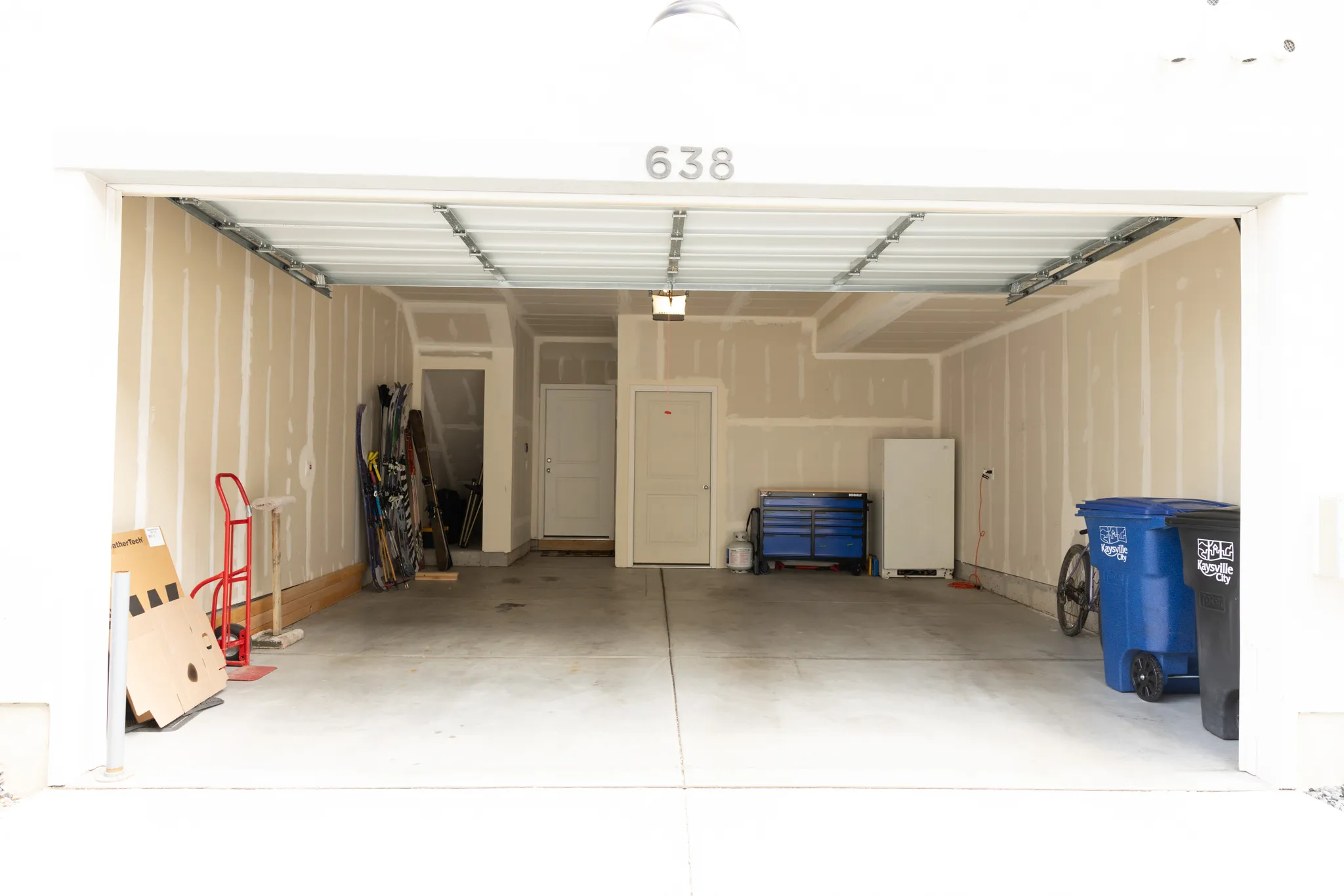 Garage with freestanding refrigerator