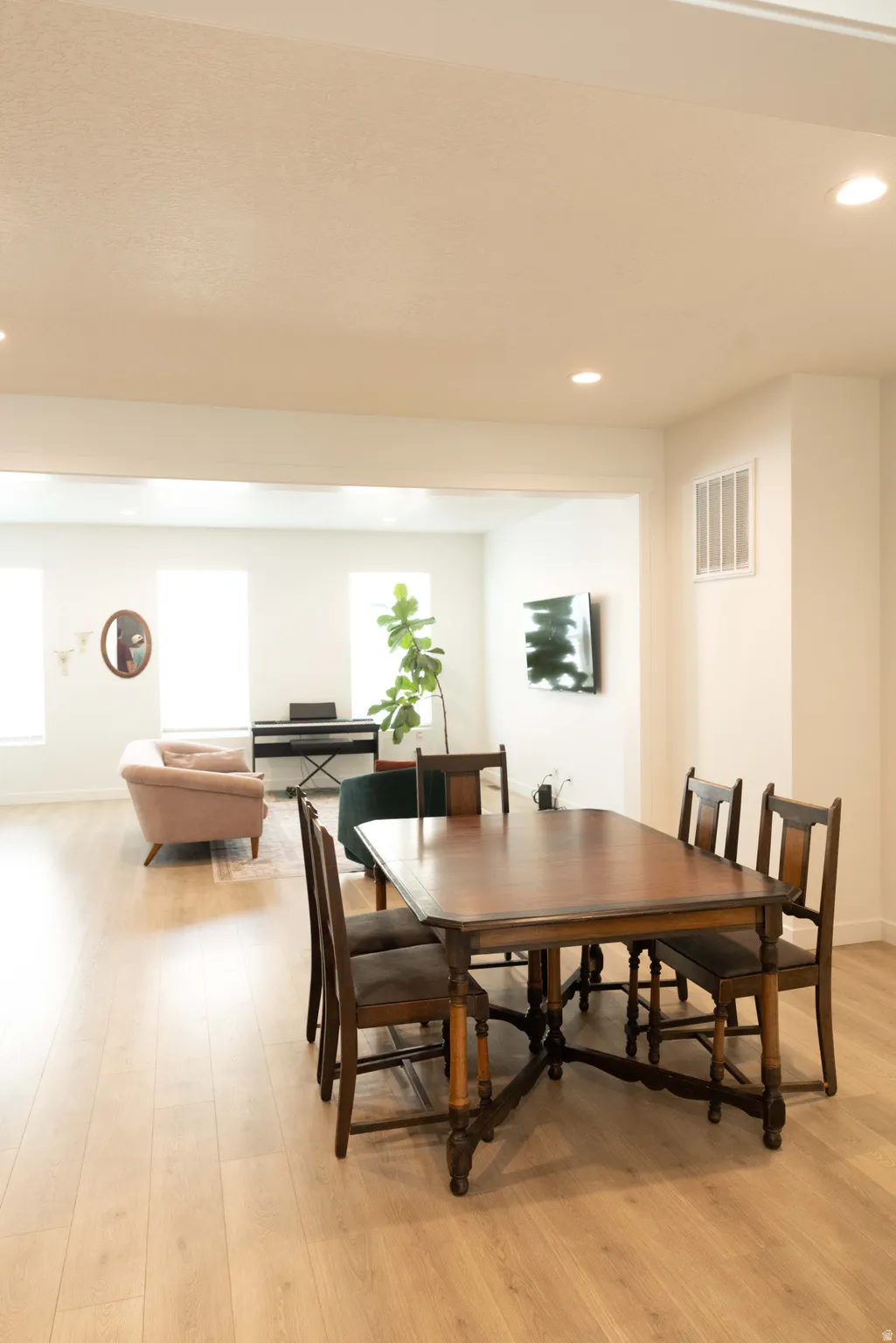 Dining space featuring light wood-style floors and recessed lighting