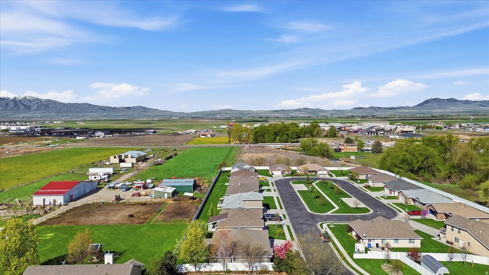 Aerial view of residential area featuring mountains