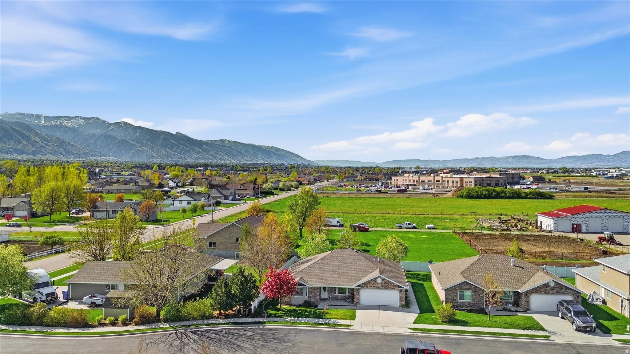 Aerial view of residential area featuring a mountain backdrop