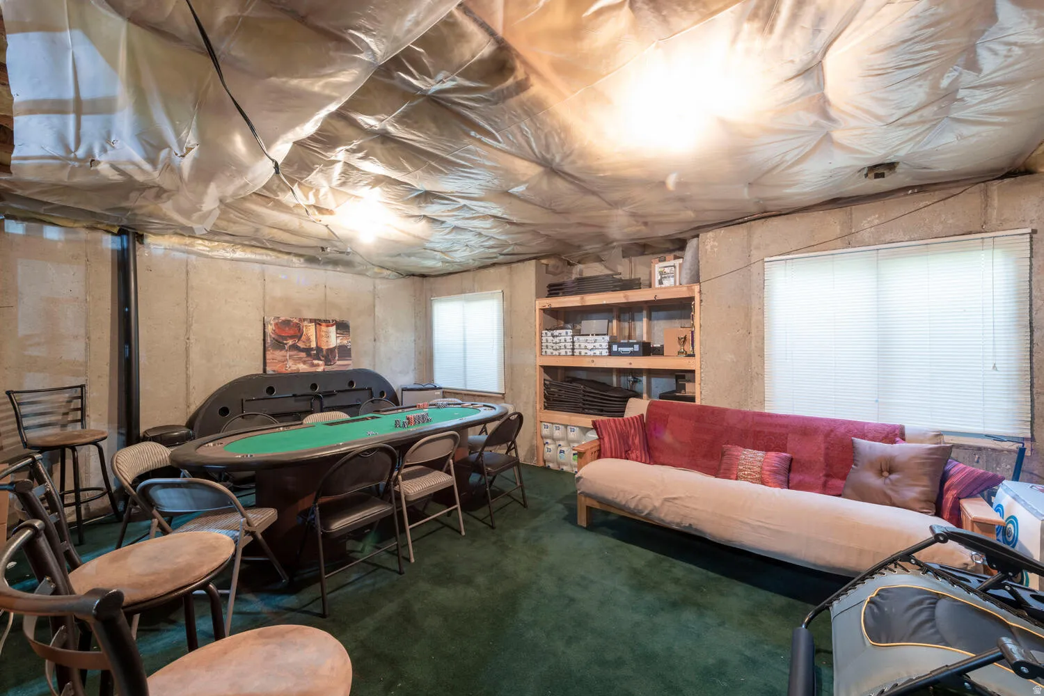 Large unfinished basement area used as a game room