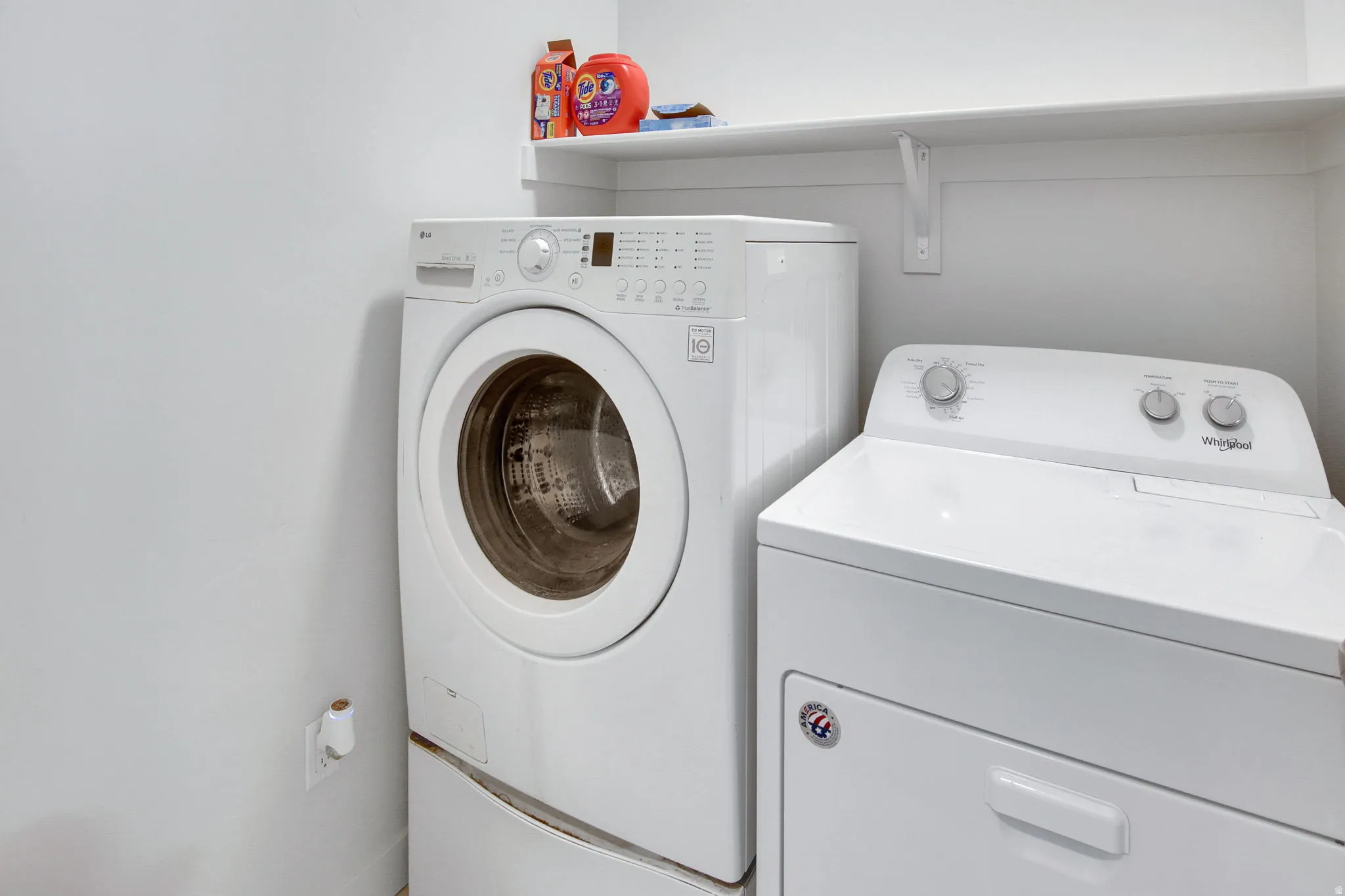 Laundry room with washer and clothes dryer