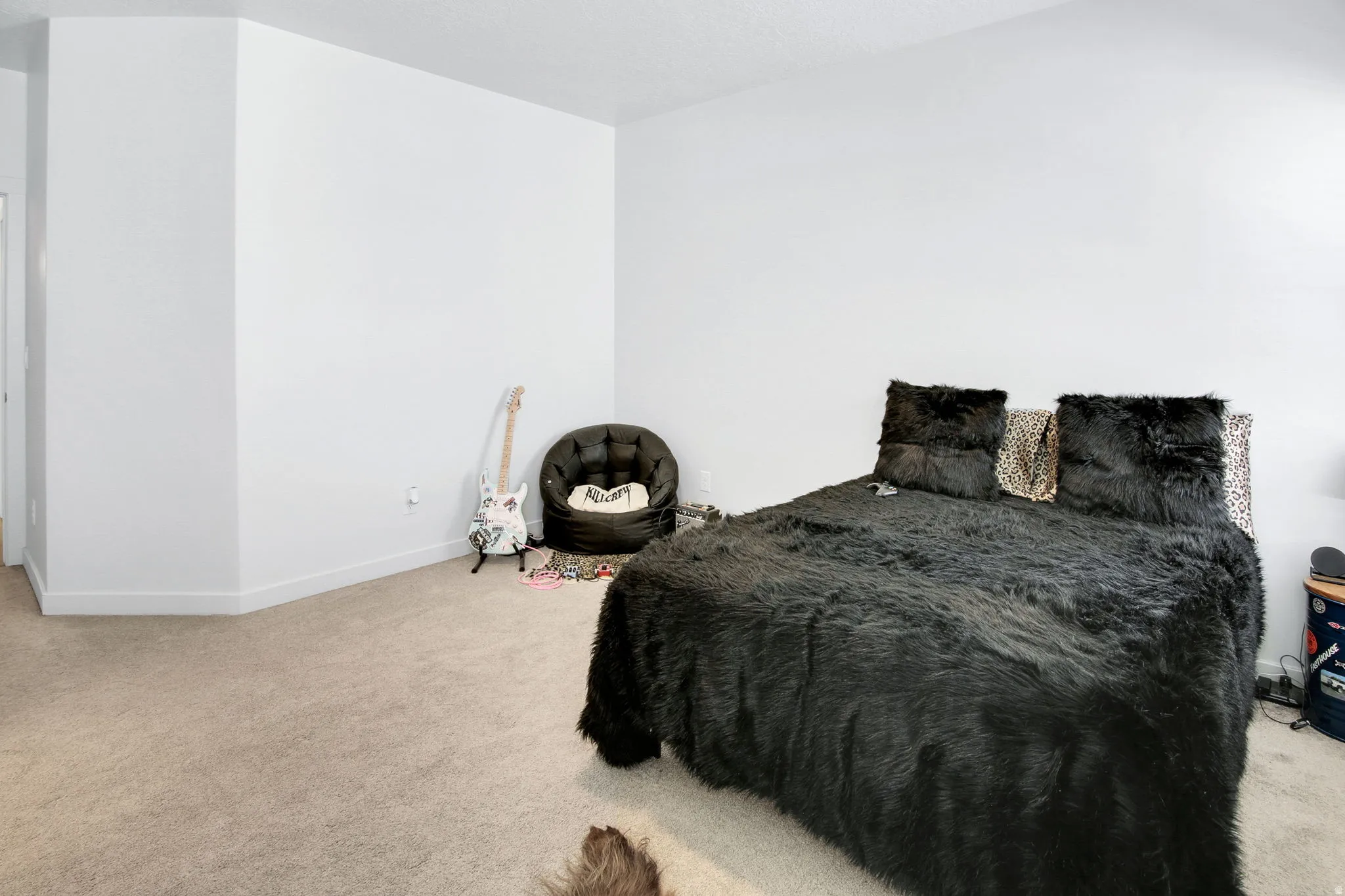 Bedroom featuring carpet flooring and baseboards