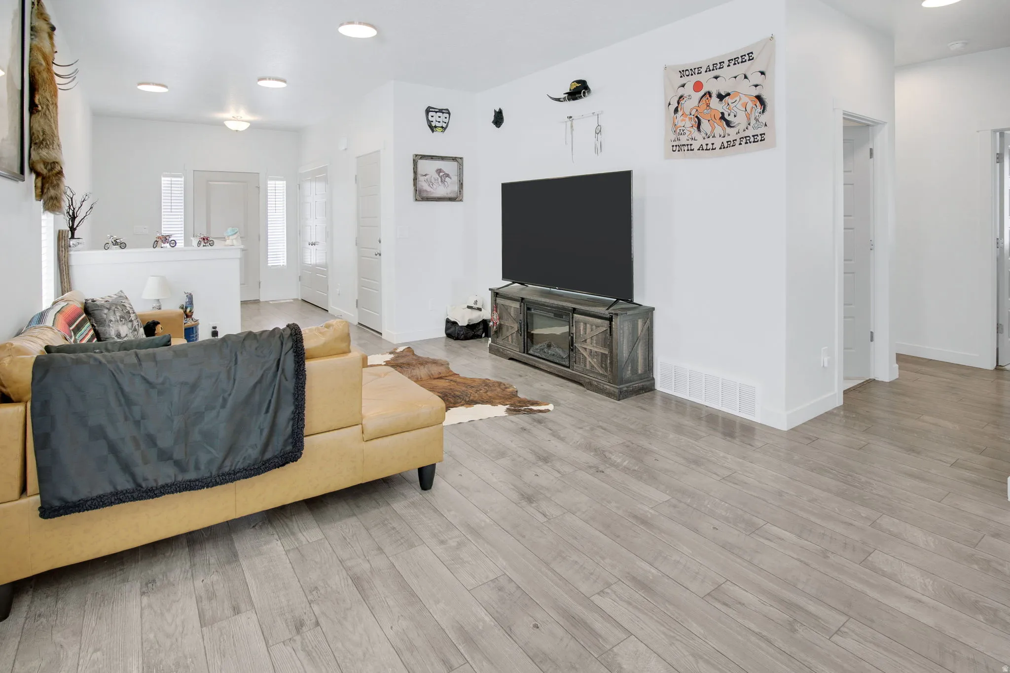Living area featuring recessed lighting and light wood finished floors