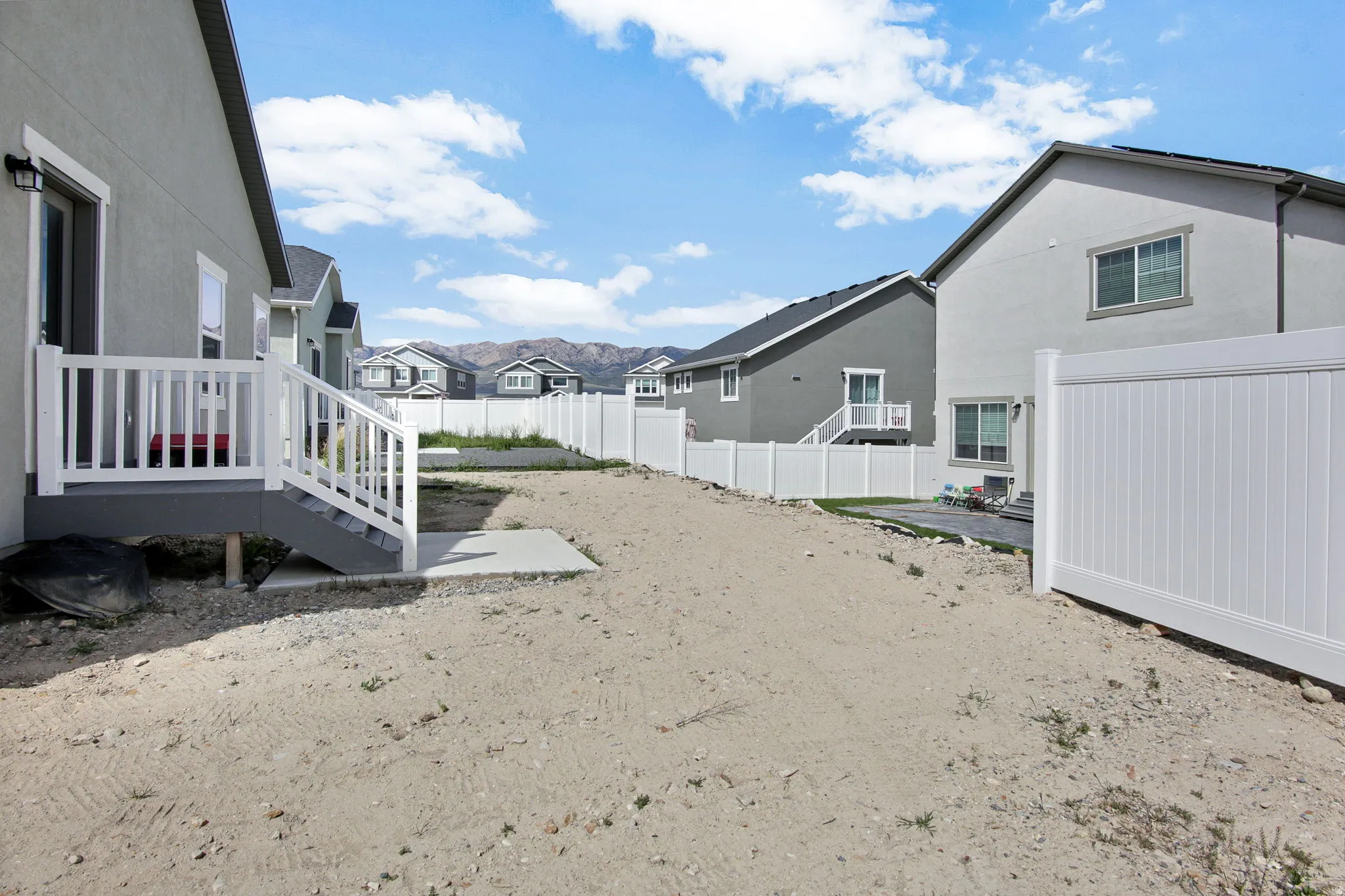 Fenced yard with a patio and a residential view