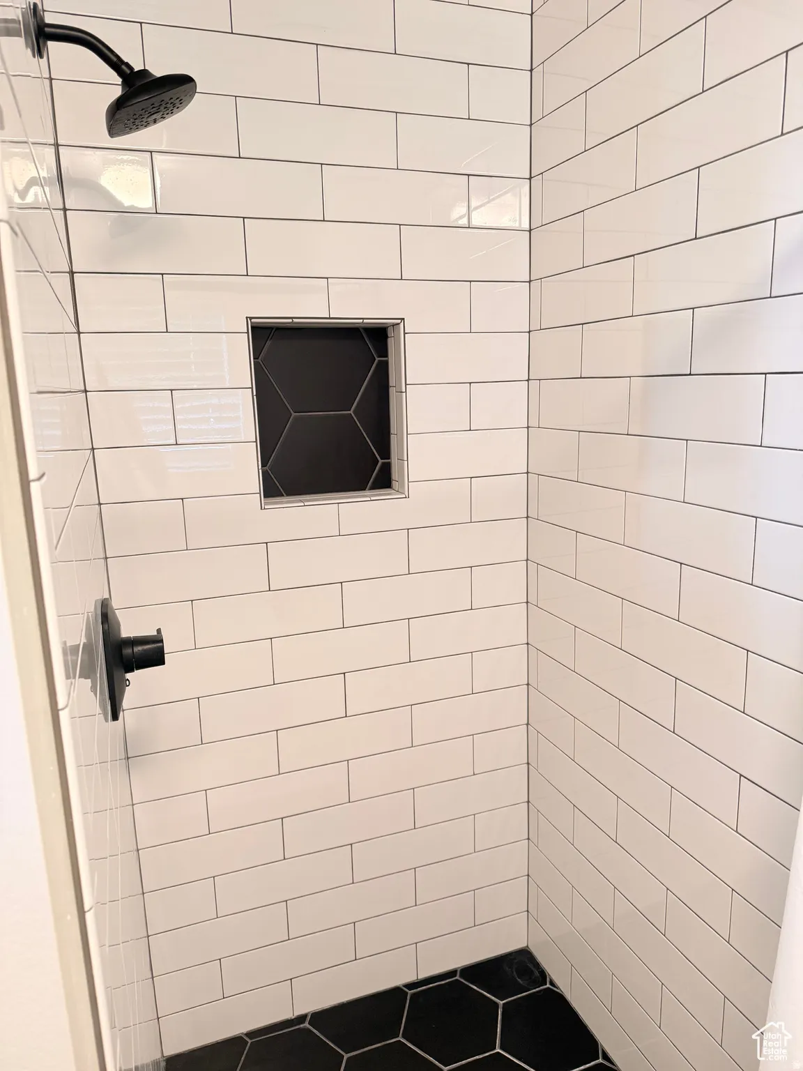 Full bath featuring a shower stall