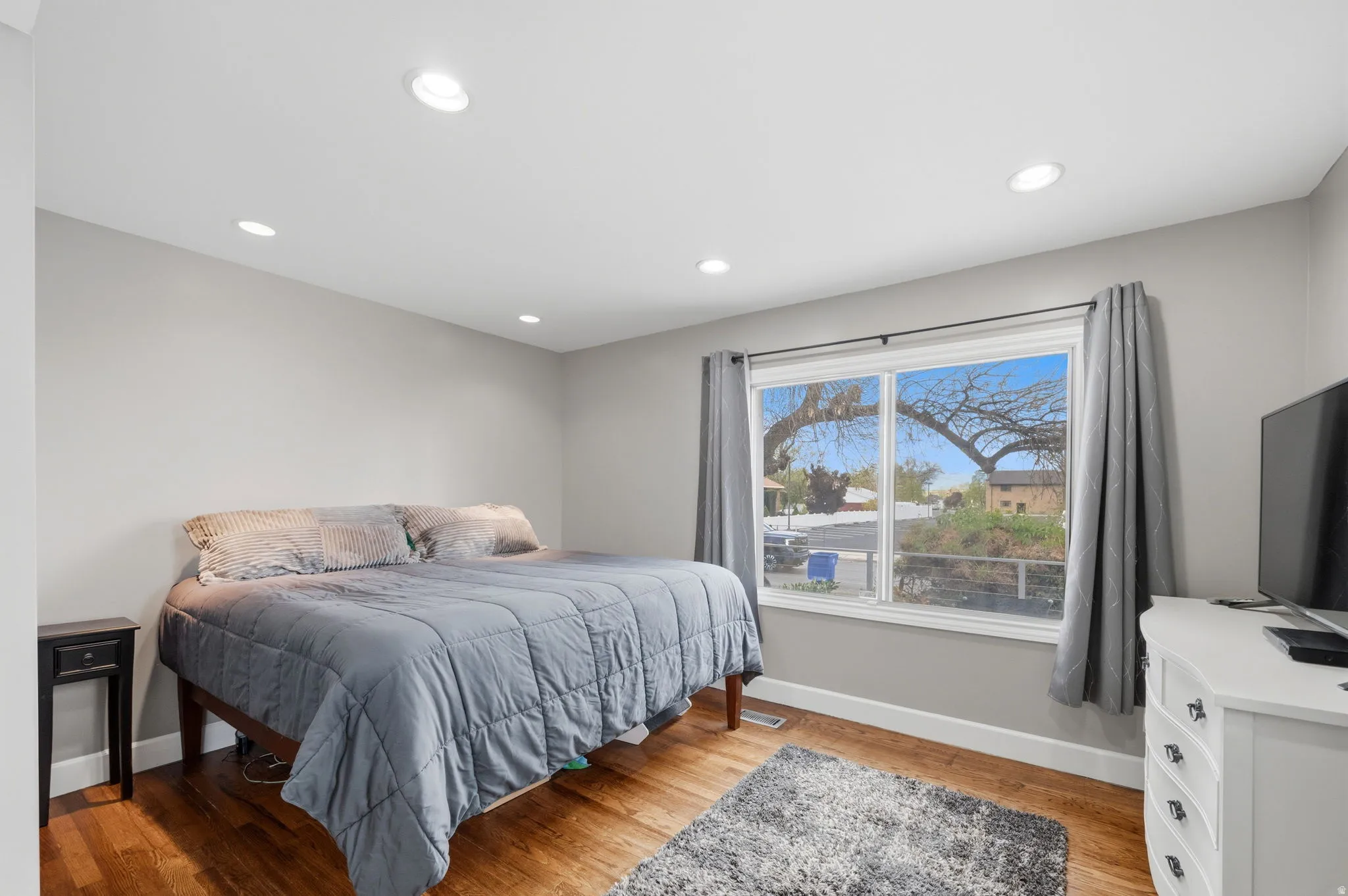 Bedroom featuring light wood finished floors and recessed lighting